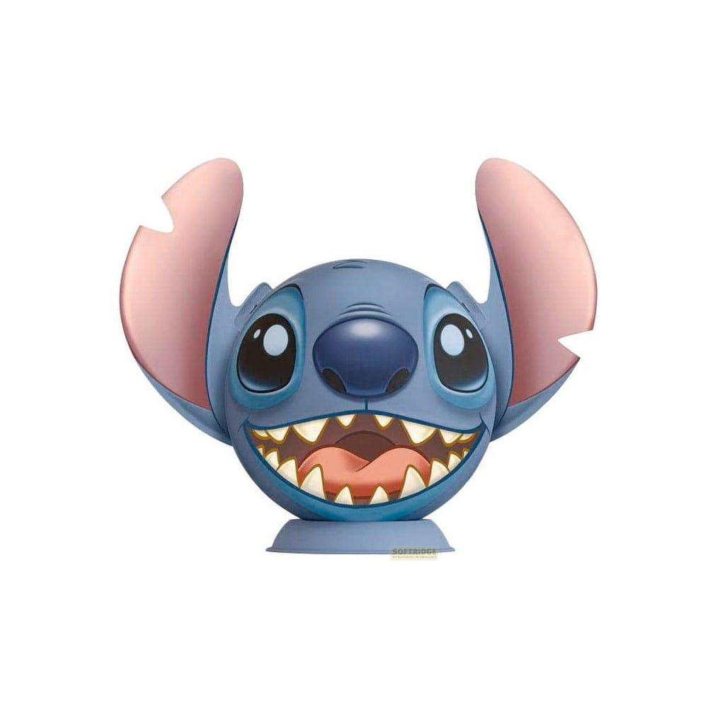 Niebieska postać z dużymi uszami i szerokim uśmiechem.