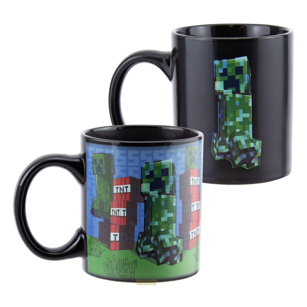 Dos tazas negras con diseños de Minecraft Creeper y TNT. Una taza muestra varios Creepers y bloques de TNT.