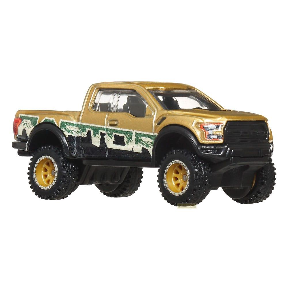 Ein goldener Ford Raptor Spielzeug-LKW mit schwarzen Akzenten und Offroad-Reifen.