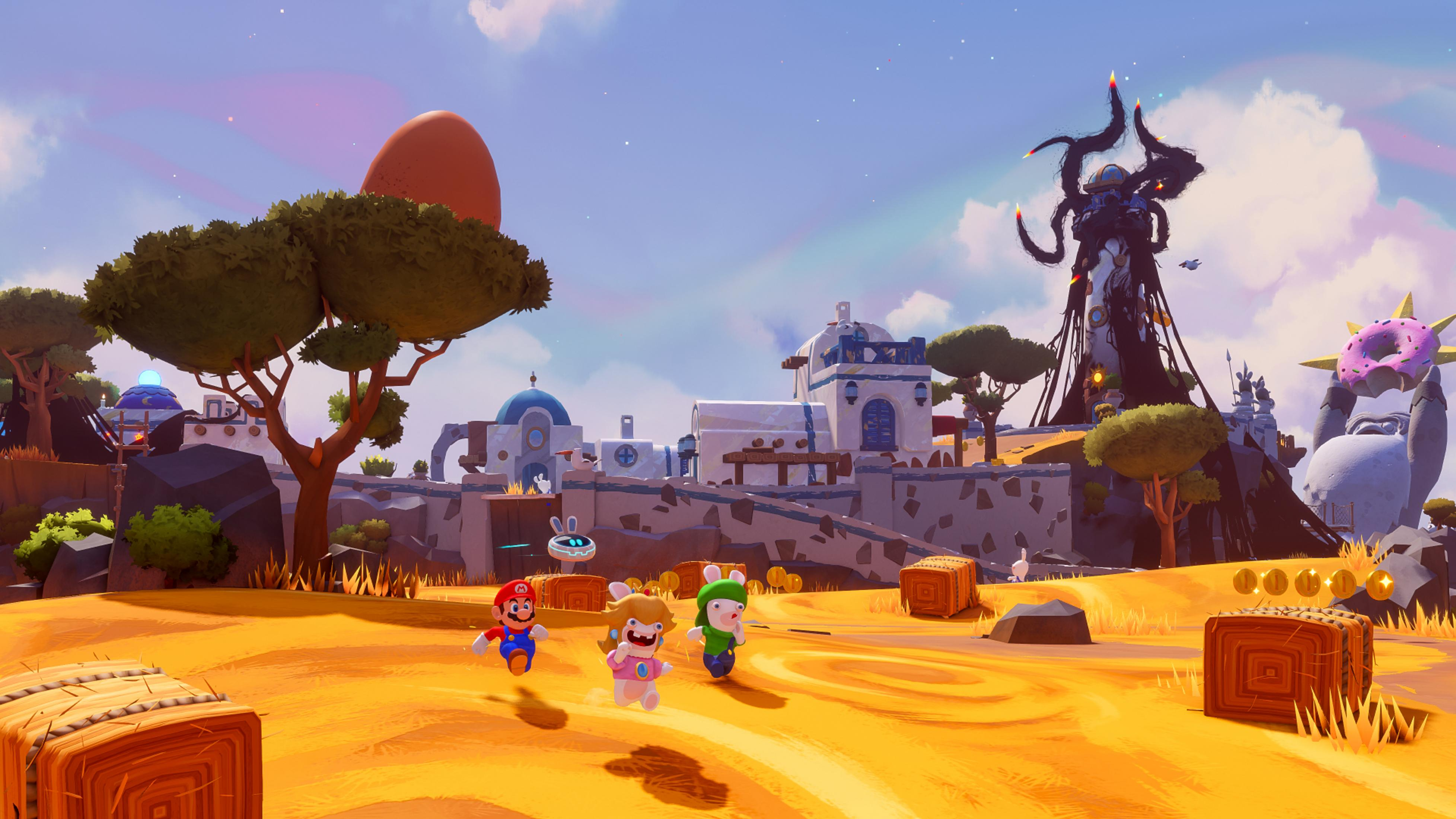 Mario et les Lapins Crétins traversent un paysage ensoleillé et désertique avec des bâtiments méditerranéens.