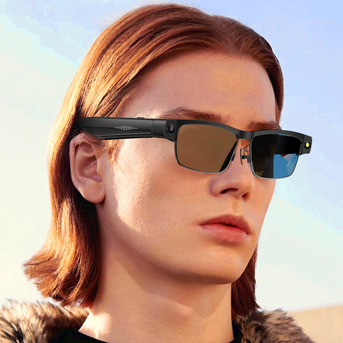 Osoba w stylowych okularach, patrzy przed siebie. Tło błękitnego nieba.