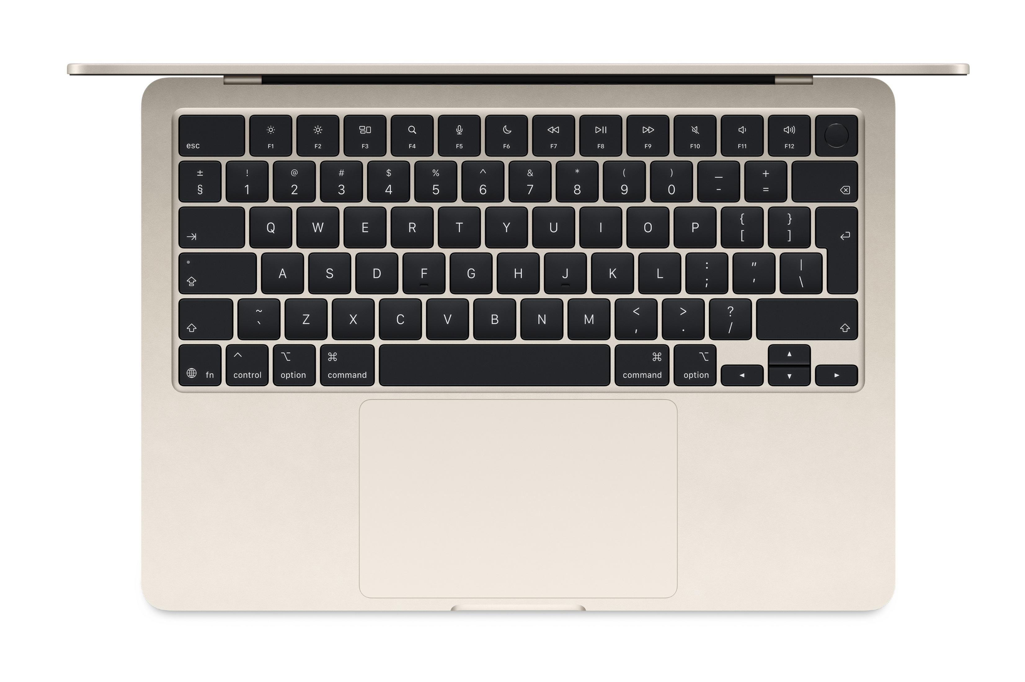 Widok z góry beżowej klawiatury laptopa z czarnymi klawiszami i dużym gładzikiem.