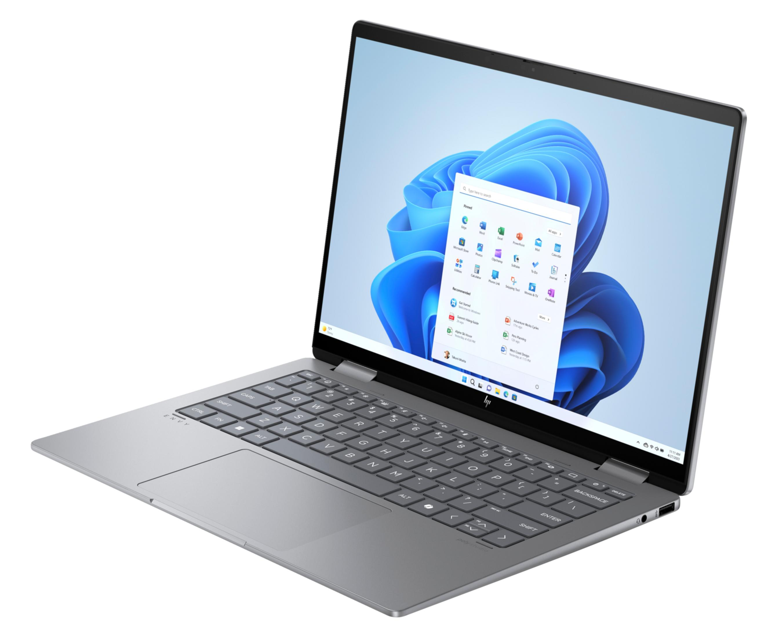 Srebrny laptop z otwartym ekranem, wyświetlający menu Start systemu Windows 11.