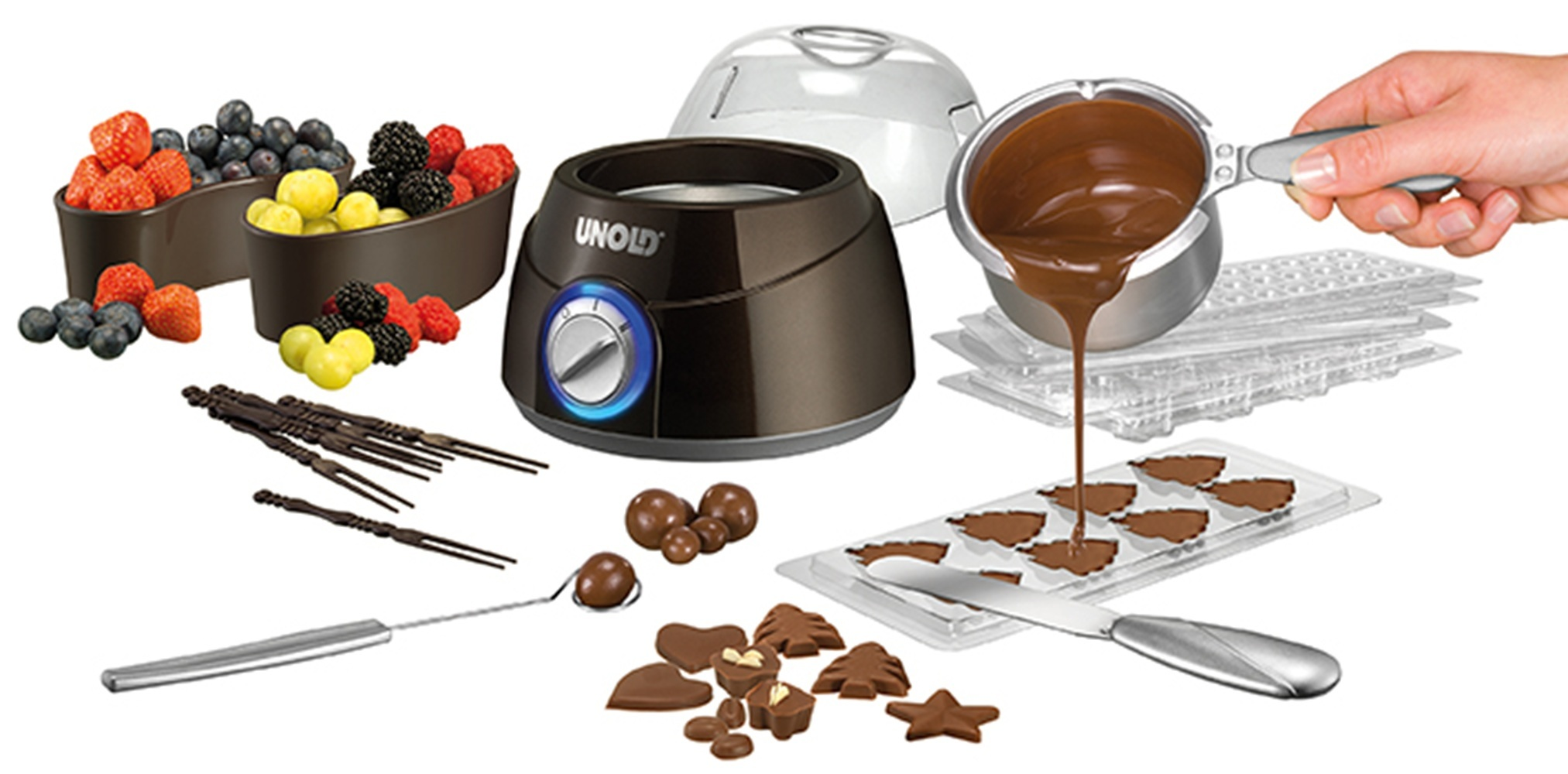 Schokoladenfondue-Set mit Früchten, Werkzeugen und Formen zum Herstellen von Pralinen.