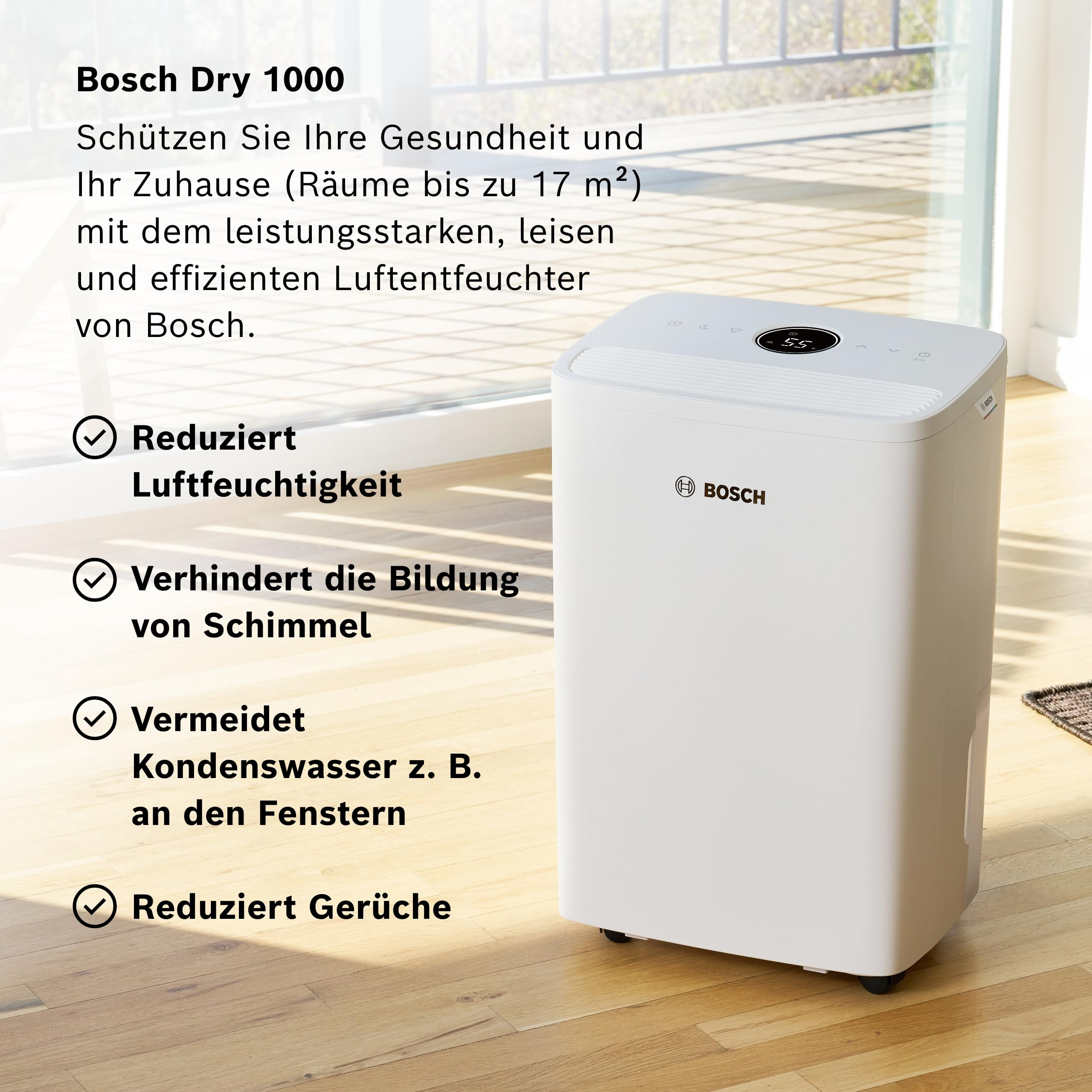 Weißer Bosch Dry 1000 Luftentfeuchter auf Holzboden, zeigt Merkmale wie reduzierte Feuchtigkeit.