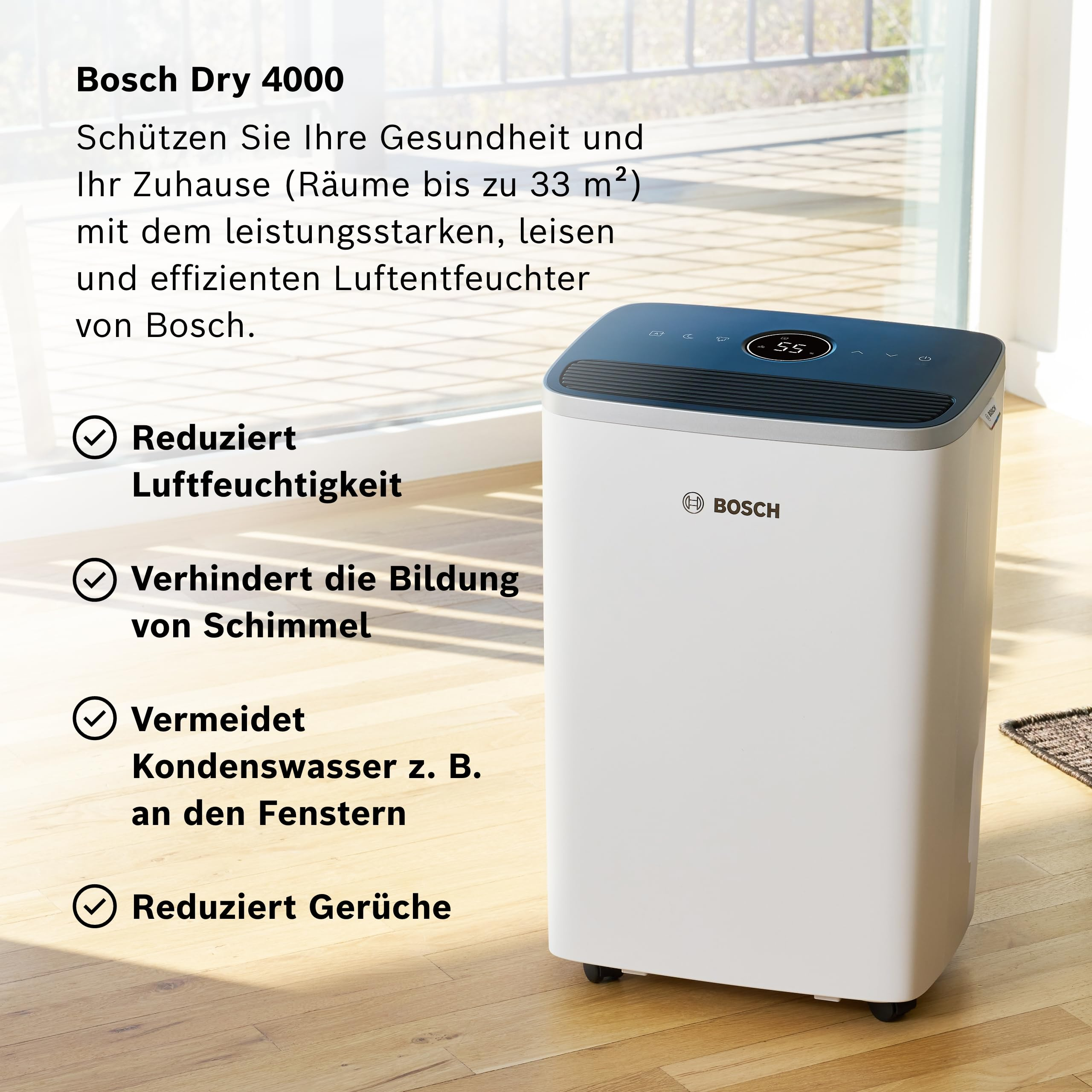 Ein weißer Bosch Luftentfeuchter mit blauem Bedienfeld steht auf einem Holzboden.