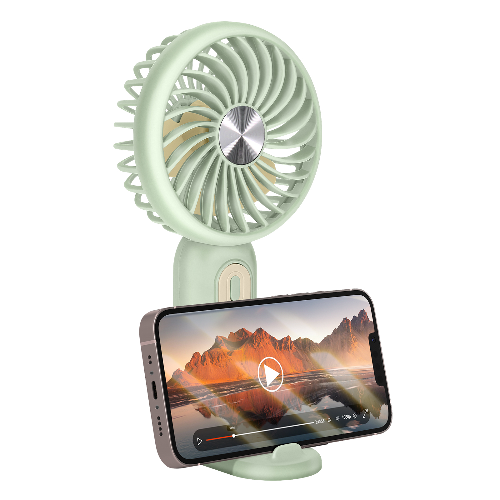 Un piccolo ventilatore verde tiene uno smartphone che mostra un video di paesaggio.
