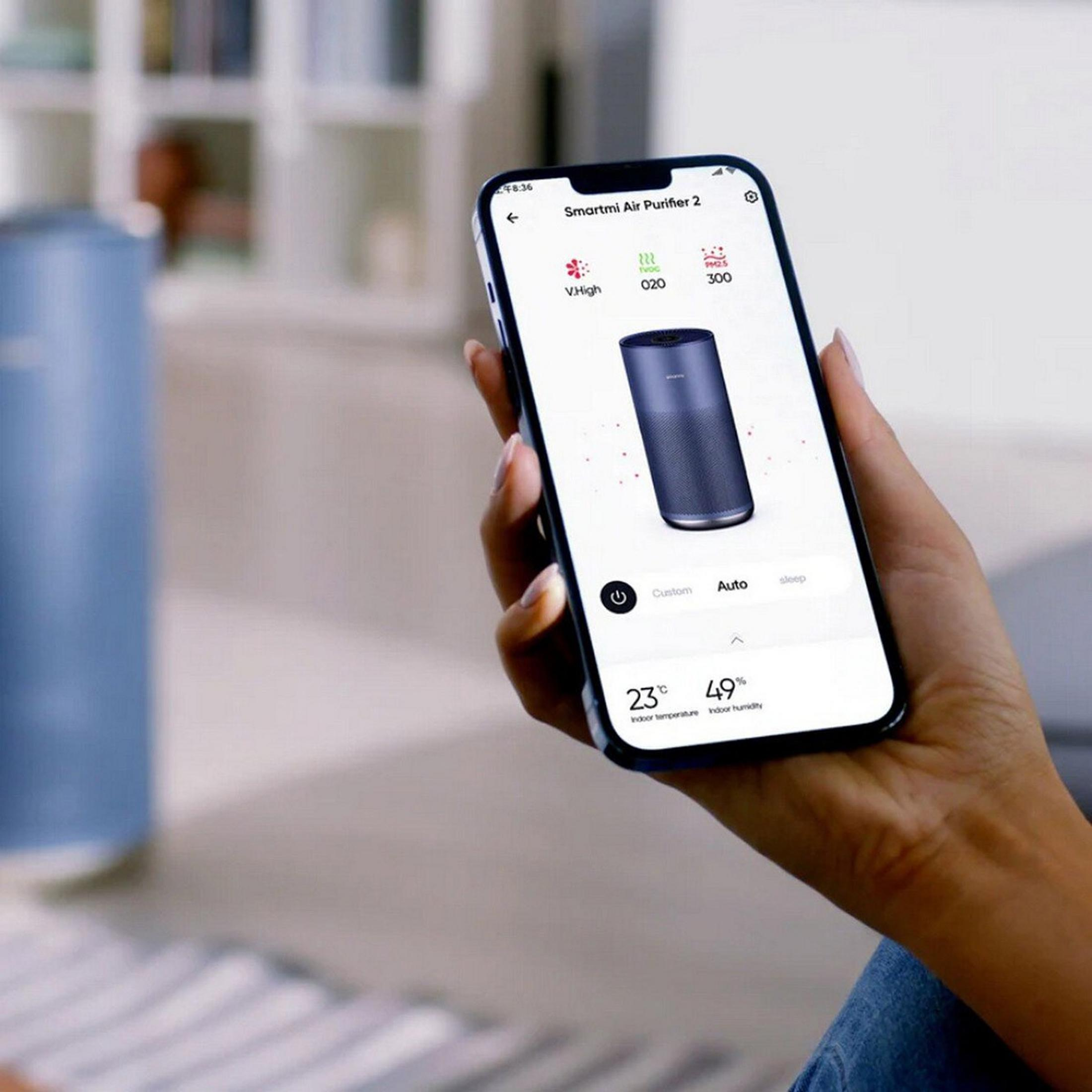 Il telefono mostra l'app Smartmi Air Purifier 2. Mostra V.High, 020 TVOC, 300 PM2.5, 23C temp, 49% umid.