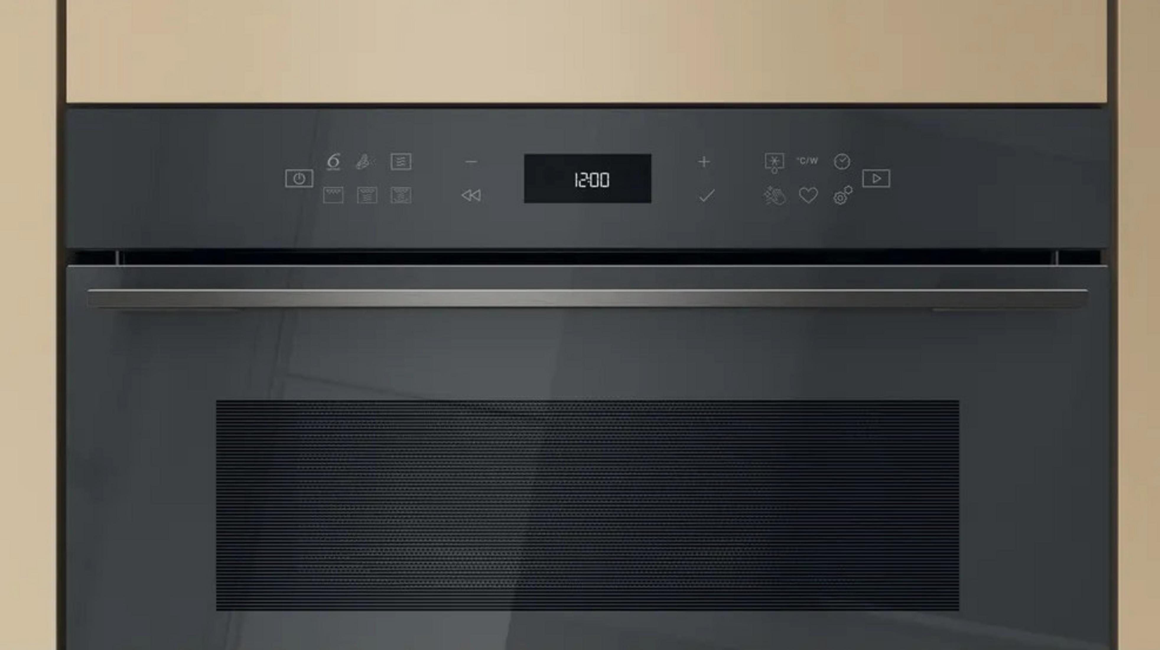 A modern black oven control panel with a digital display showing 12:00.