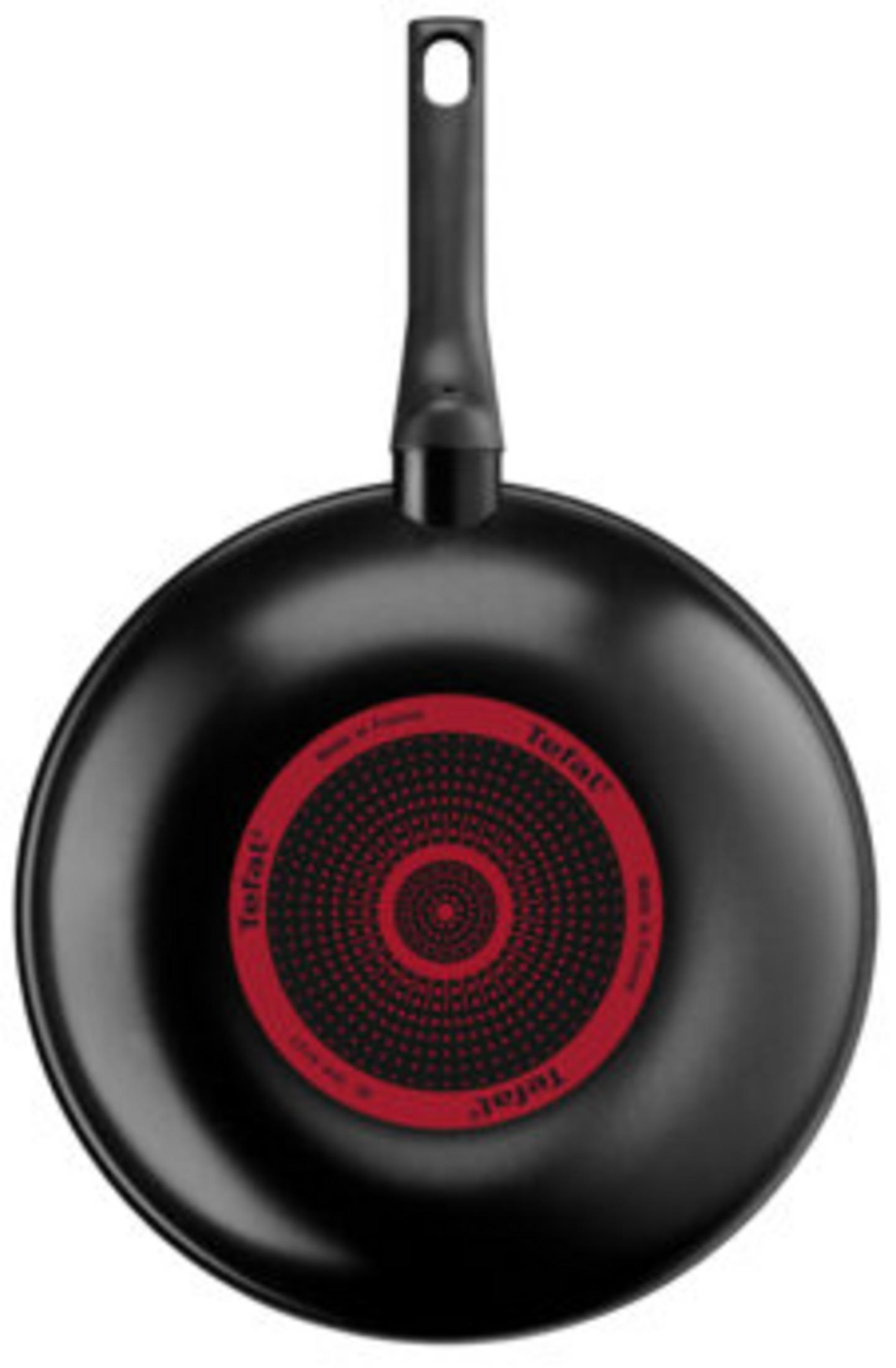 Czarna patelnia wok Tefal z czerwonym, okrągłym wskaźnikiem ciepła na spodzie.