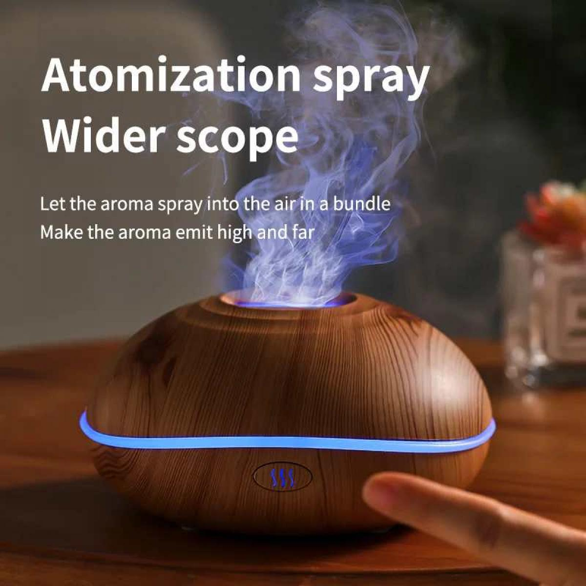 Ein holzfarbener Diffusor sprüht blauen Dampf, beleuchtet von einer blauen LED-Leiste.