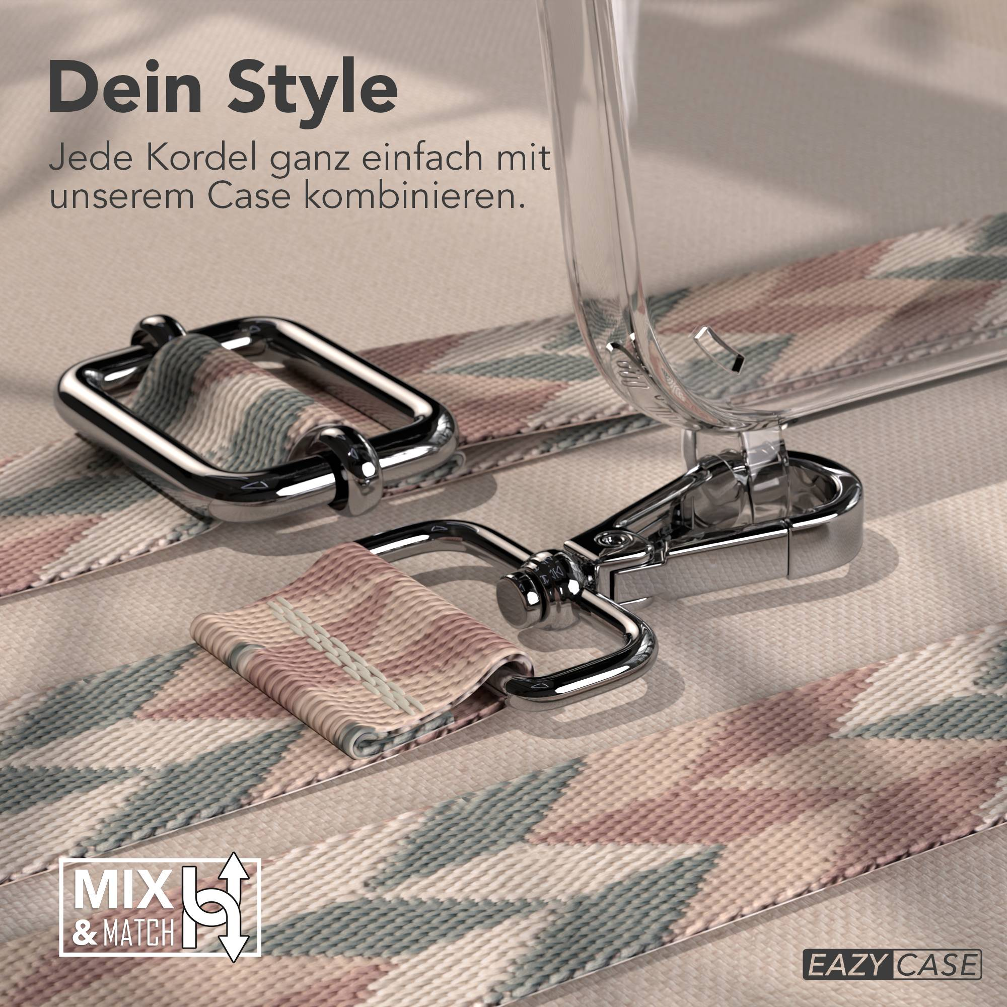 Ein Band mit geometrischem Muster und silbernen Schnallen liegt auf einem Stoff.