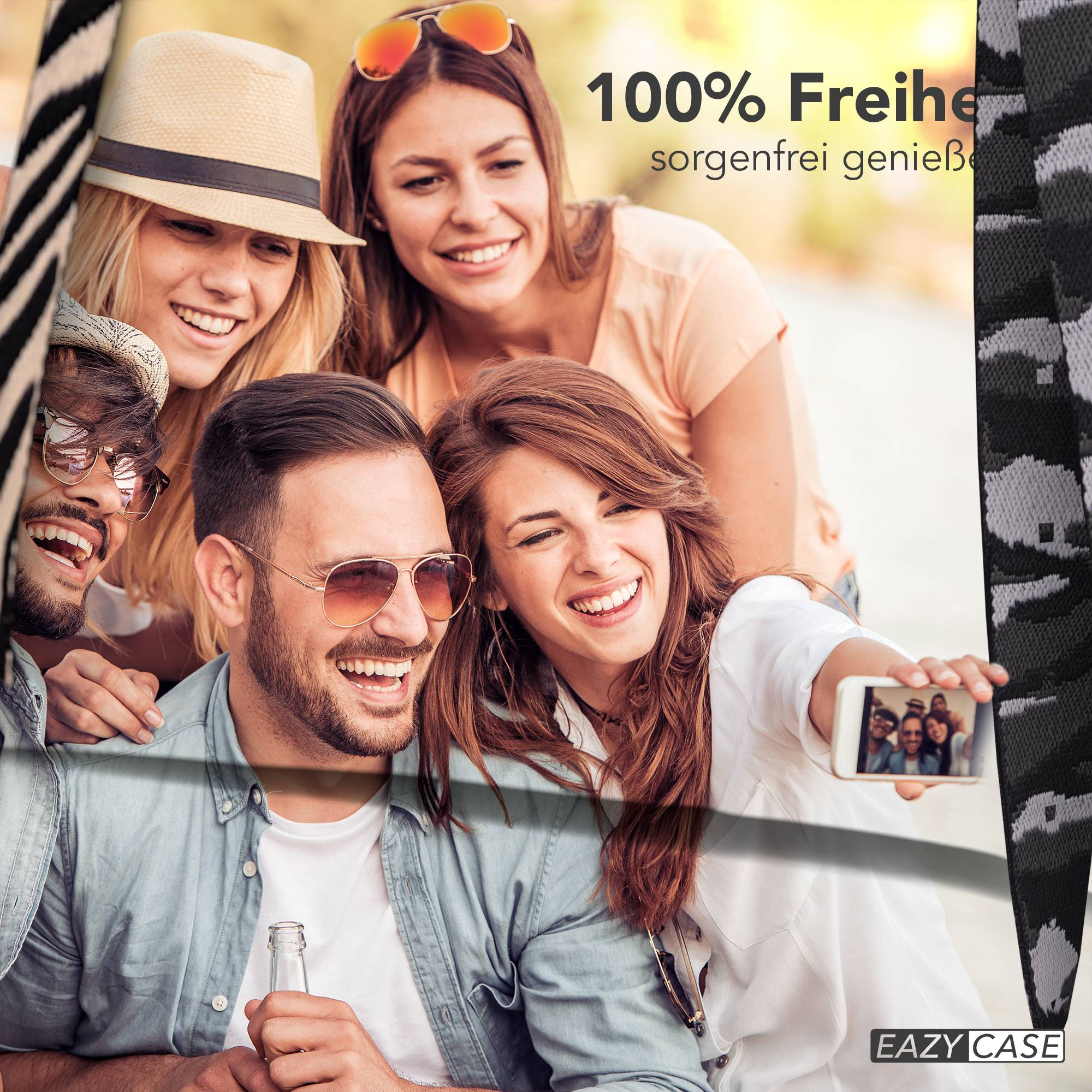 Freunde machen ein Selfie im Freien. Eine Frau hält ein Handy.