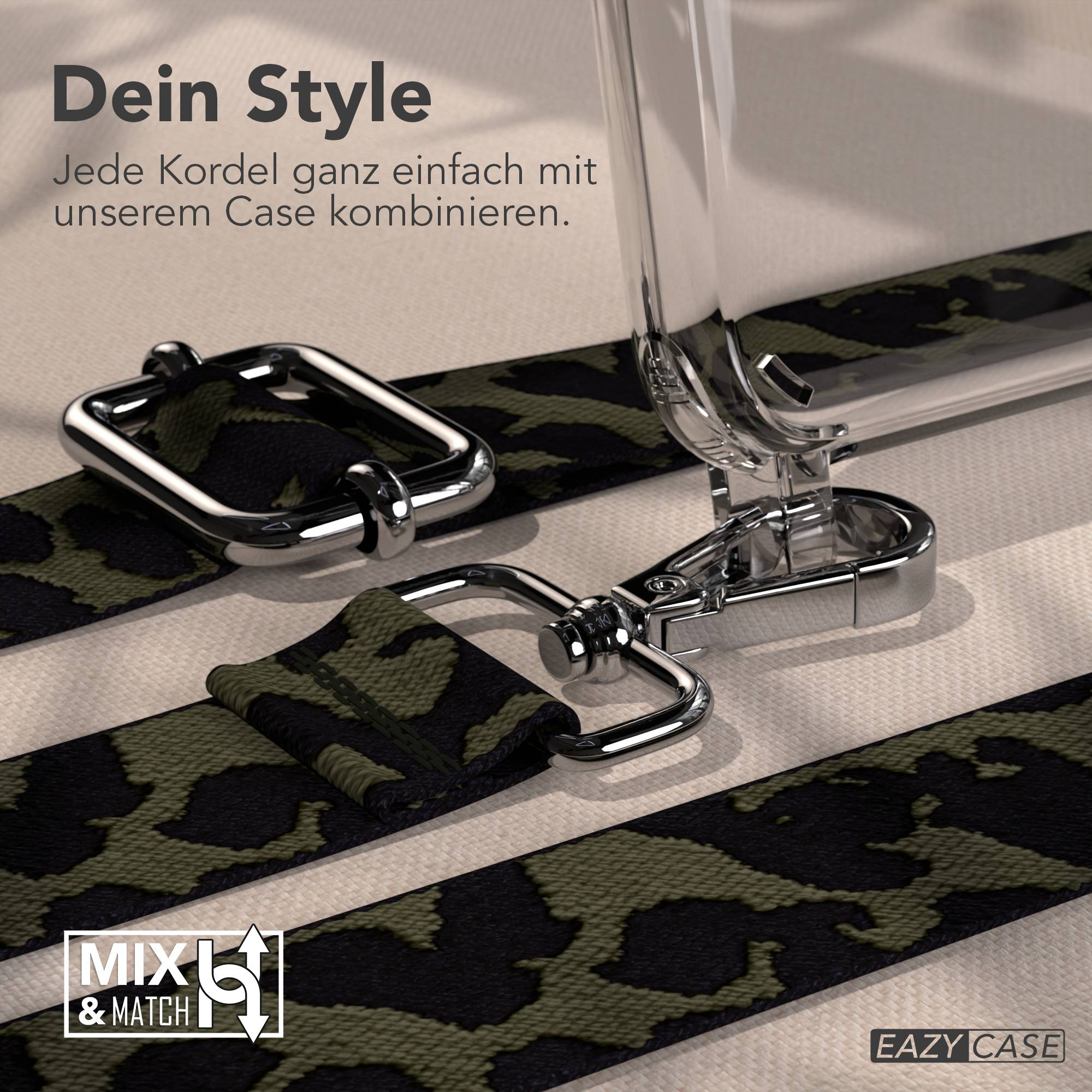 Ein Camouflage-Muster-Riemen mit silbernen Beschlägen, der an einem transparenten Koffer befestigt ist.