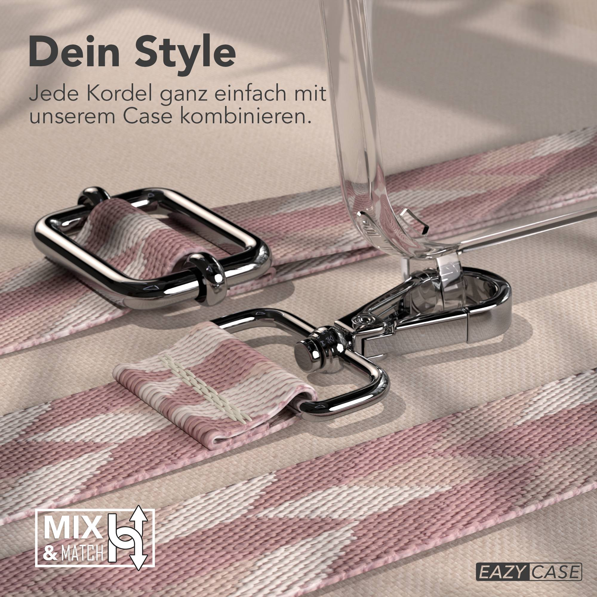 Nahaufnahme eines rosa-weißen gemusterten Riemens mit silbernen Verschlüssen auf beiger Textur.