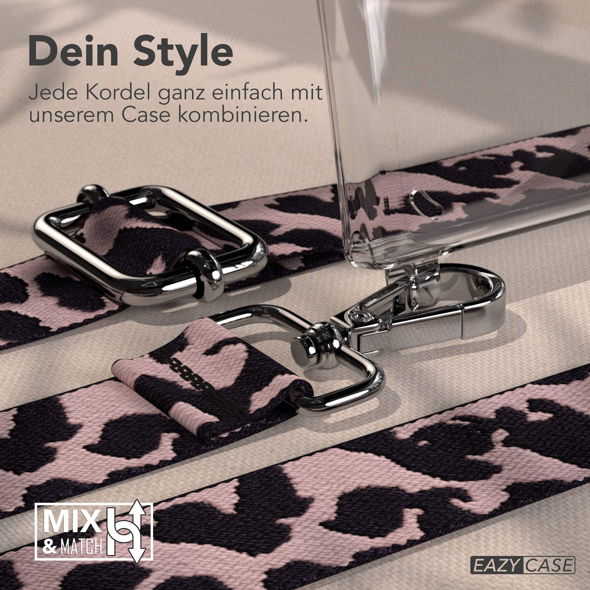 Ein pinkfarbenes Band mit Leopardenmuster und silbernen Beschlägen liegt auf einem hellen Untergrund.