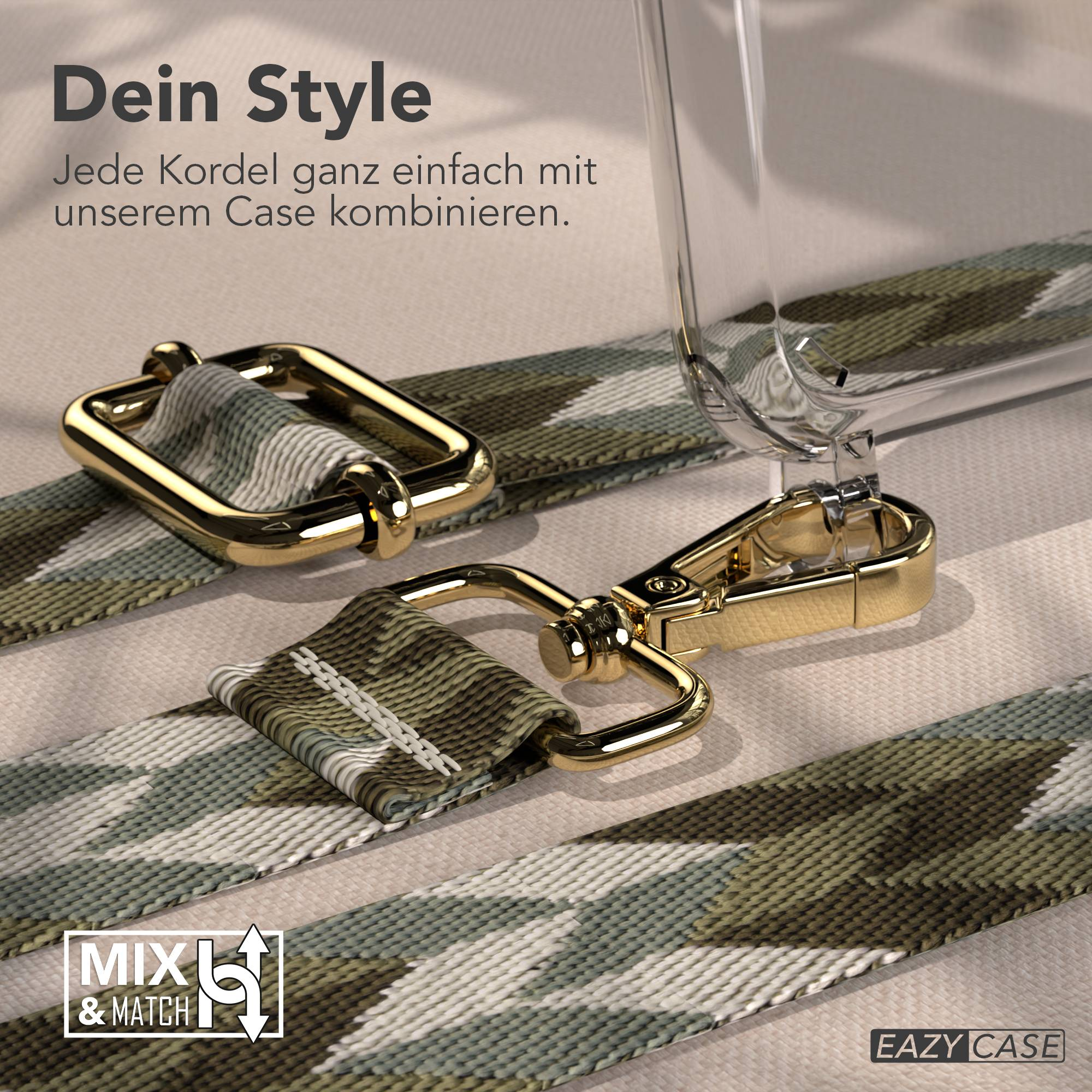 Ein Tarnfarben-Band mit goldenen Beschlägen liegt auf hellem Stoff.