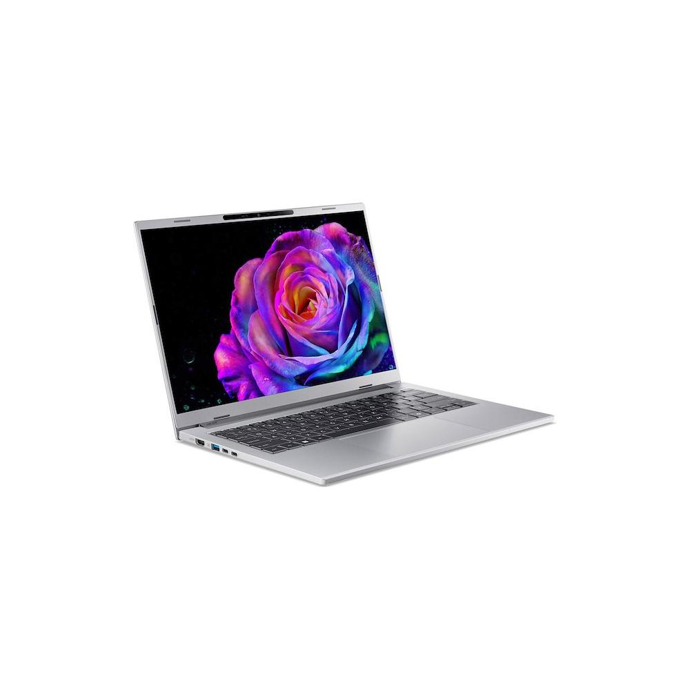 Un laptop aperto mostra una rosa colorata sullo schermo su sfondo nero.