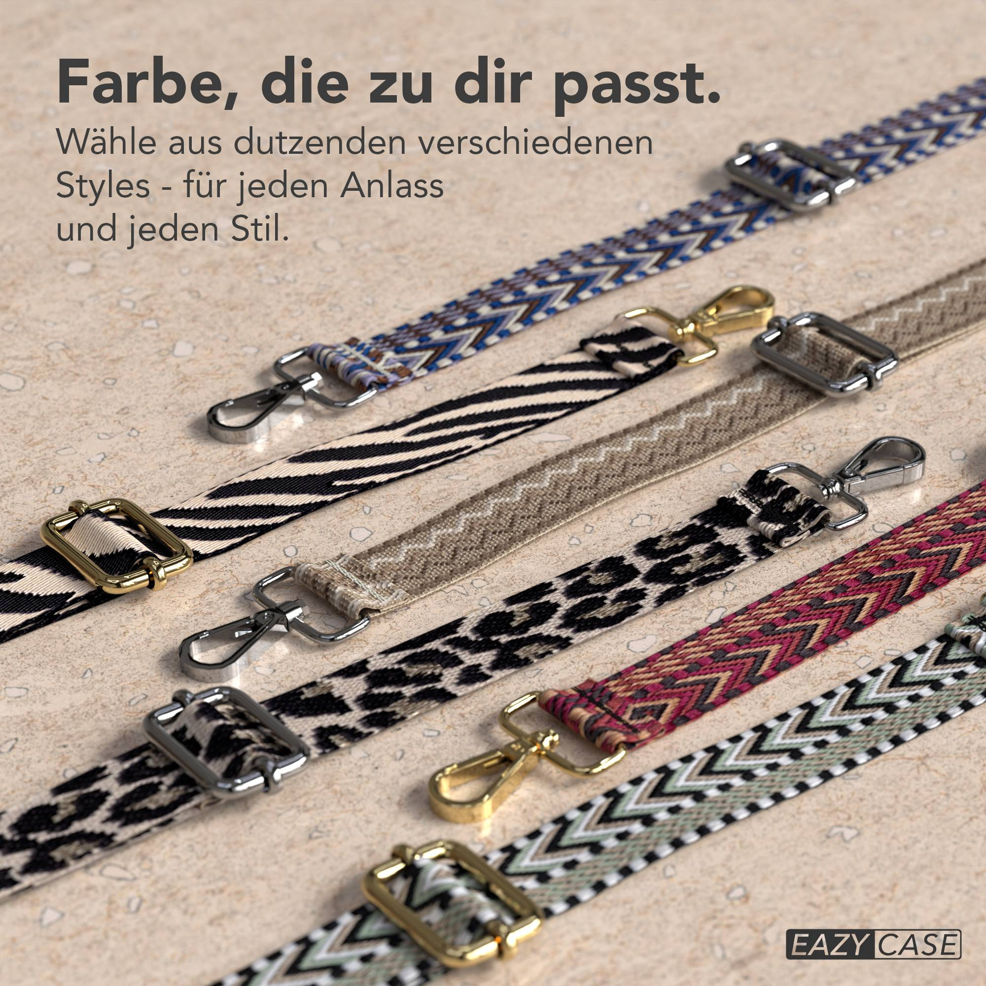 Sortiment gemusterter Riemen mit Metallverschlüssen auf strukturierter Oberfläche.