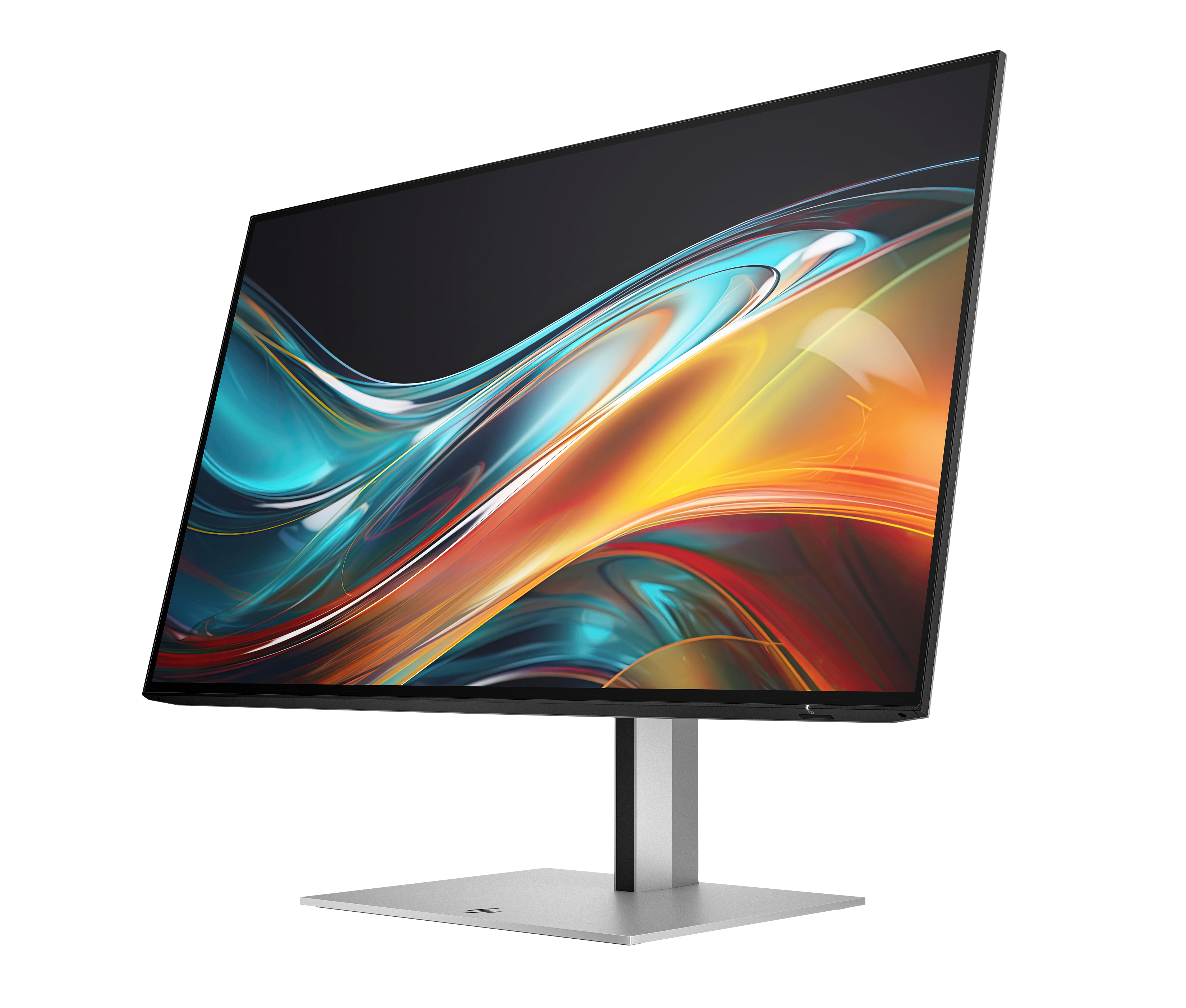 Un monitor de computadora moderno con ondas coloridas abstractas en la pantalla, sobre un soporte plateado.