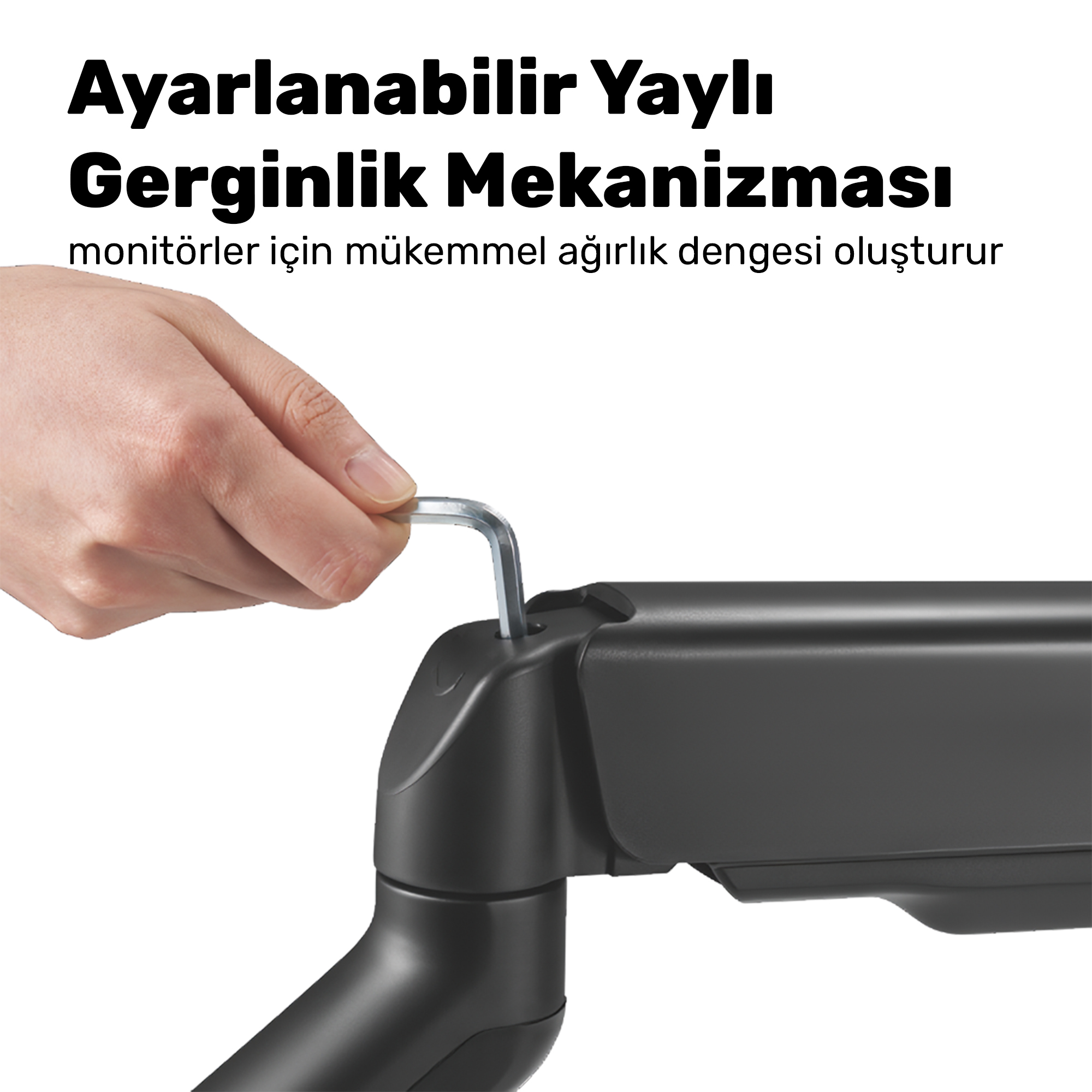 Bir el, siyah bir monitör kolu mekanizmasını ayarlamak için alyan anahtar kullanıyor.