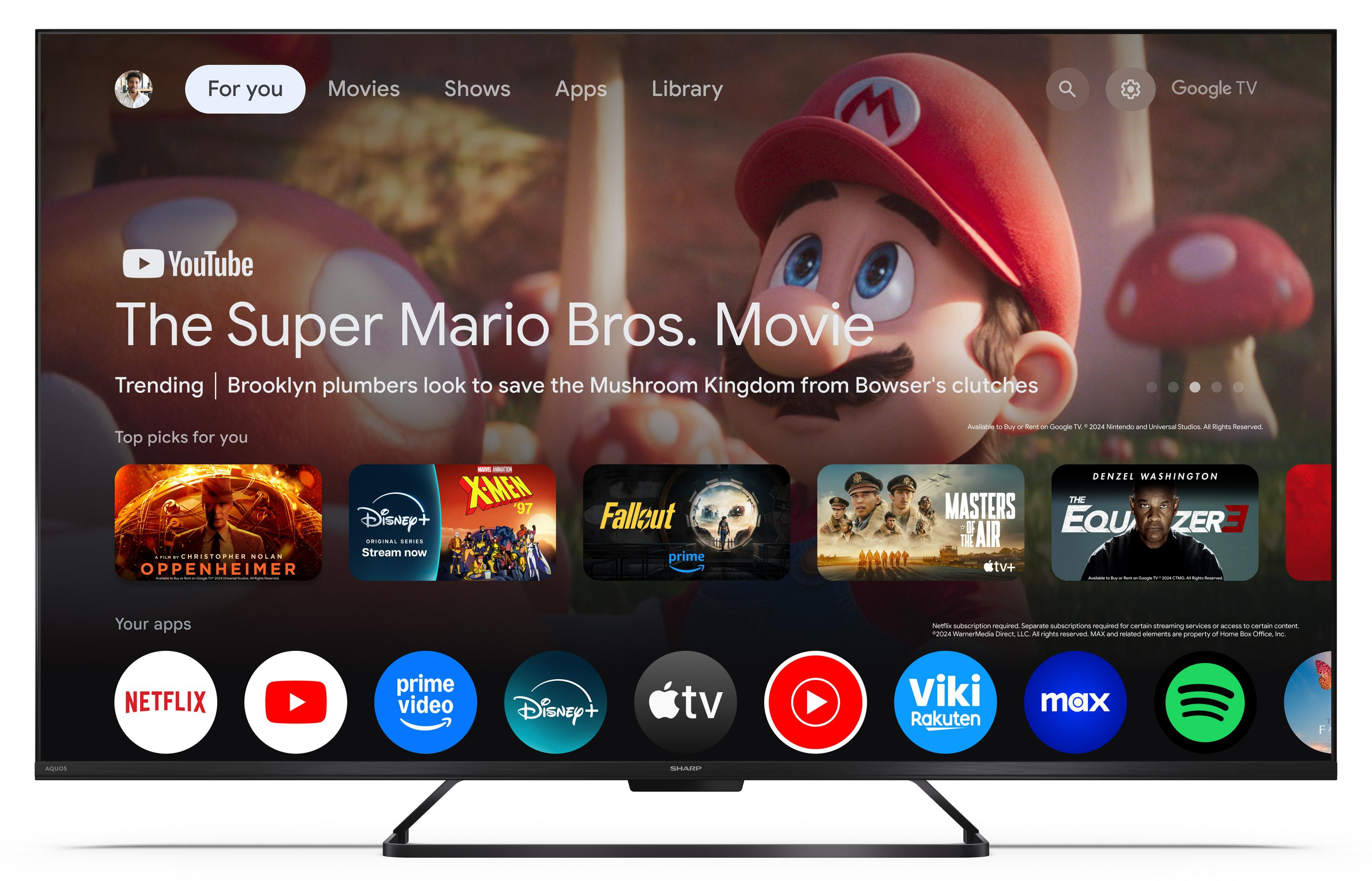 Ekran główny Google TV z Mario, filmami i aplikacjami. Rekomendacje na górze.
