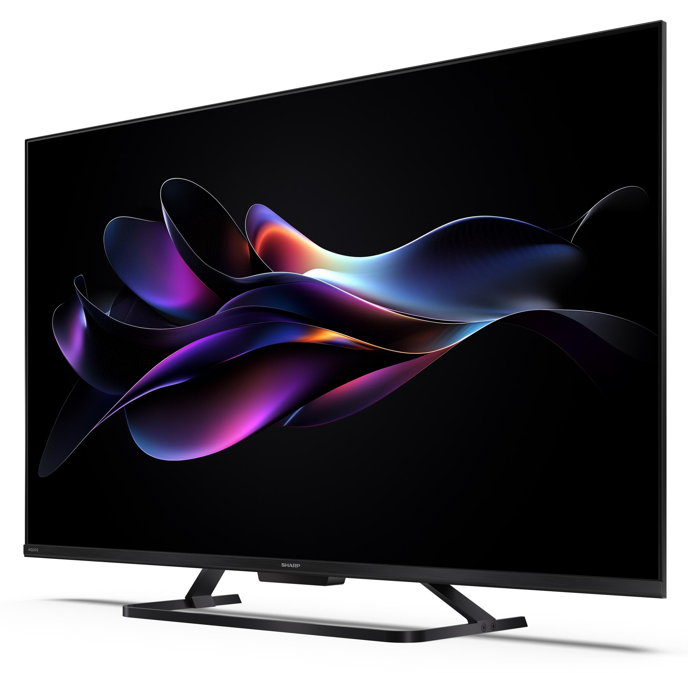 Un televisore moderno che visualizza un screensaver astratto e colorato.