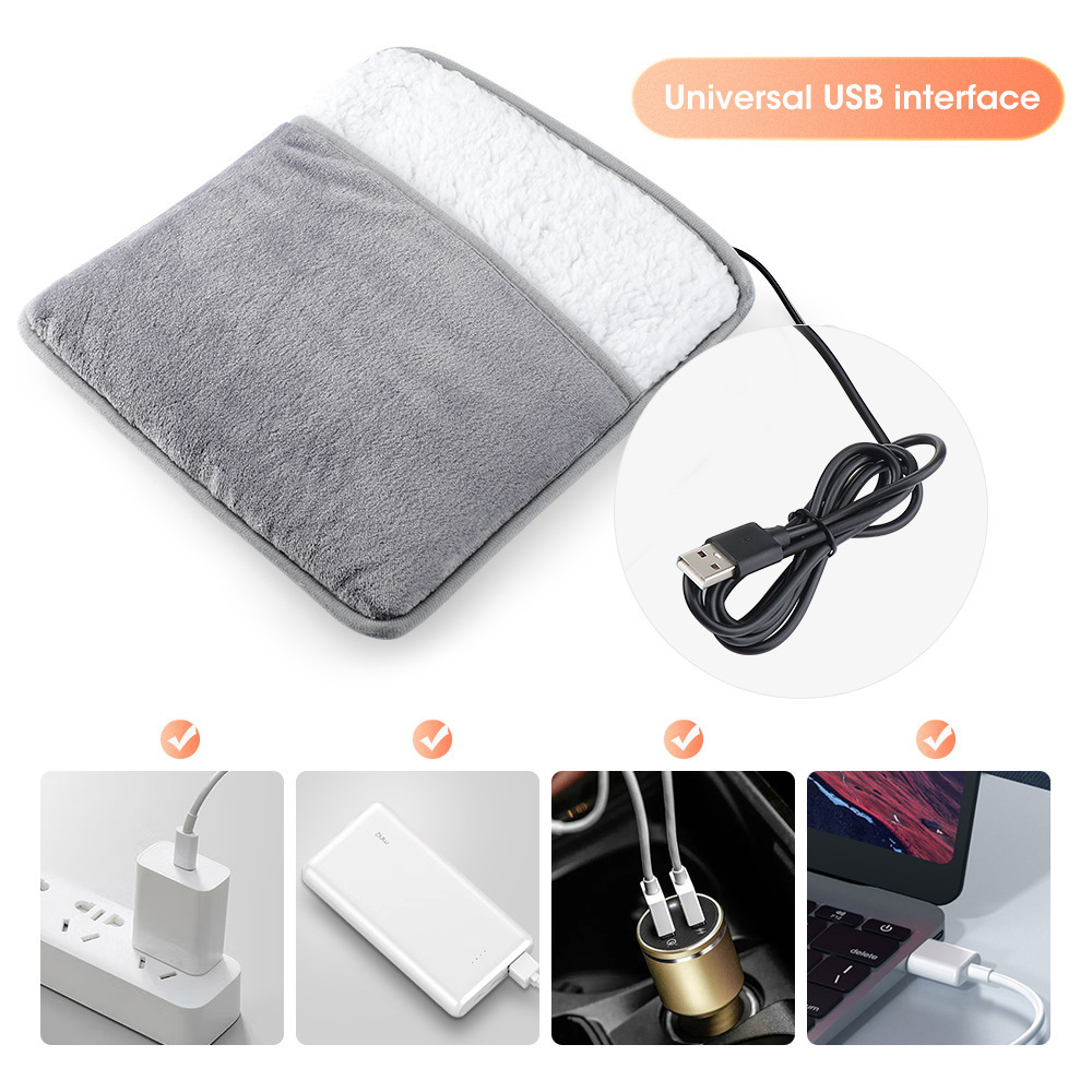 Graues Heizkissen mit Sherpafutter, USB-Kabel und Ladeoptionen.
