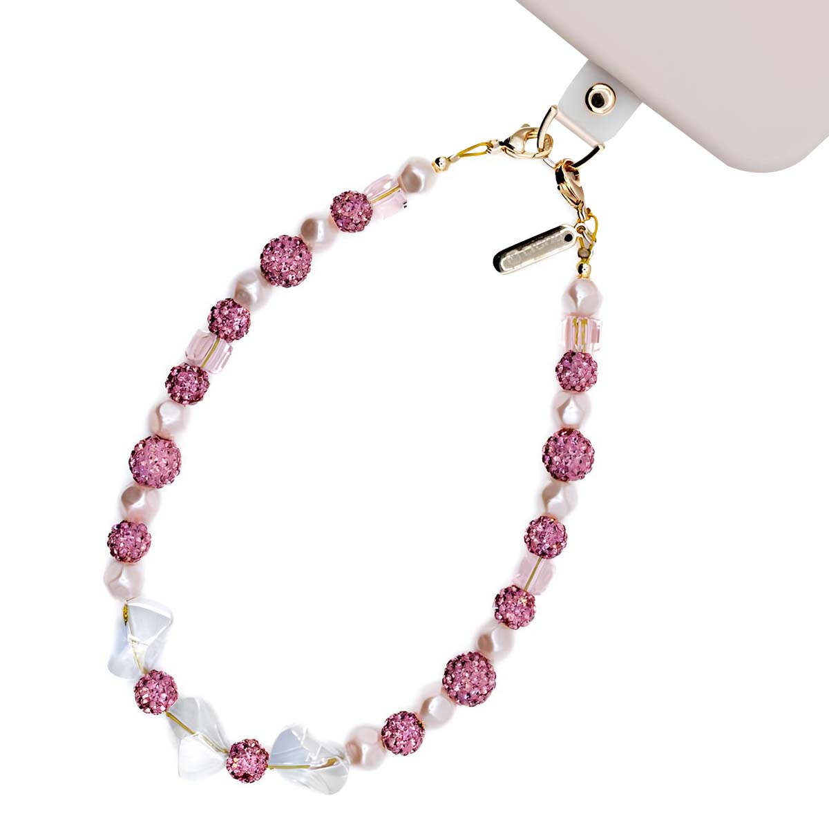 Un cinturino per telefono con perline rosa con sfere di strass e ciondoli trasparenti.