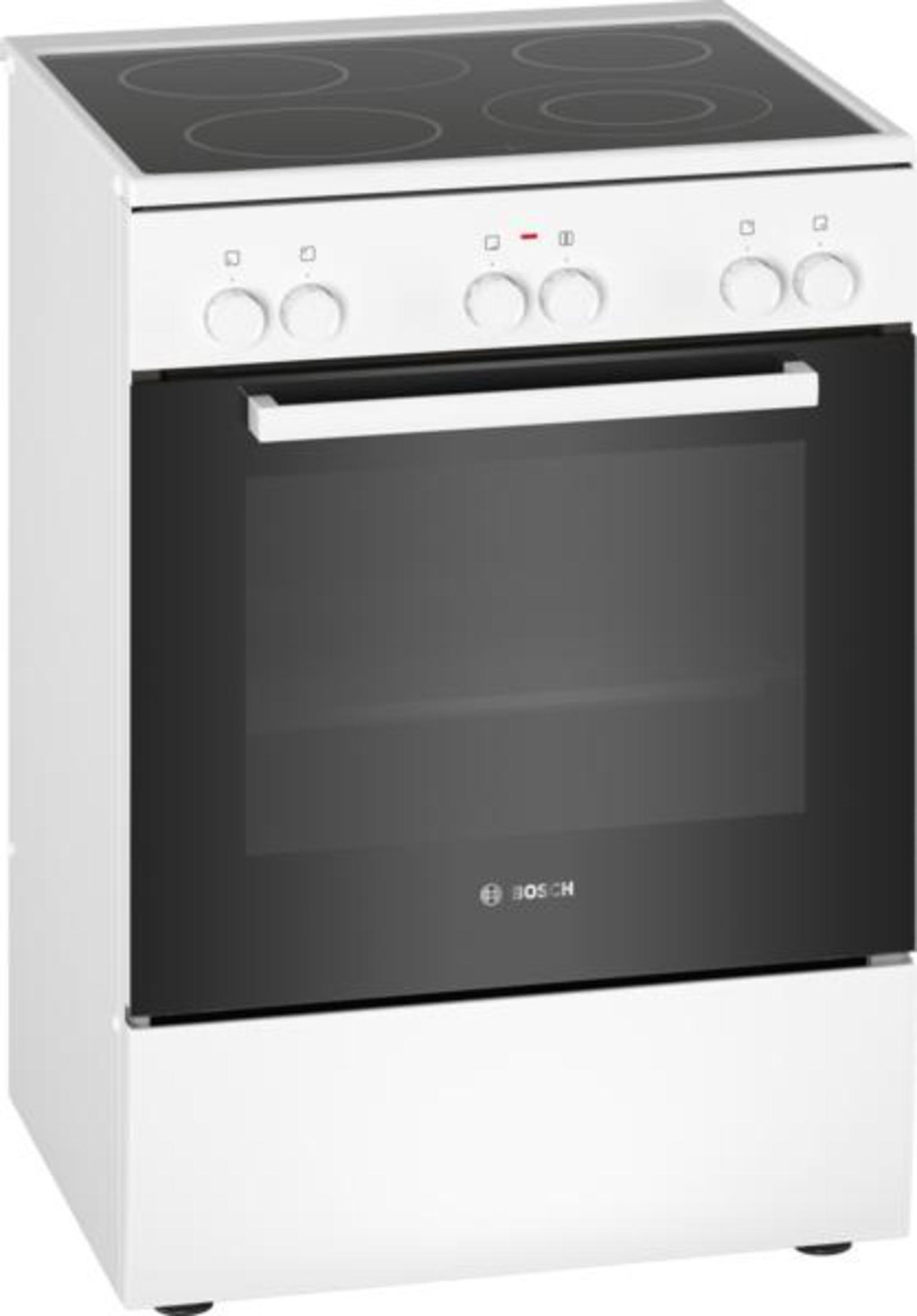 Un forno bianco indipendente con porta in vetro nero e quattro fuochi.