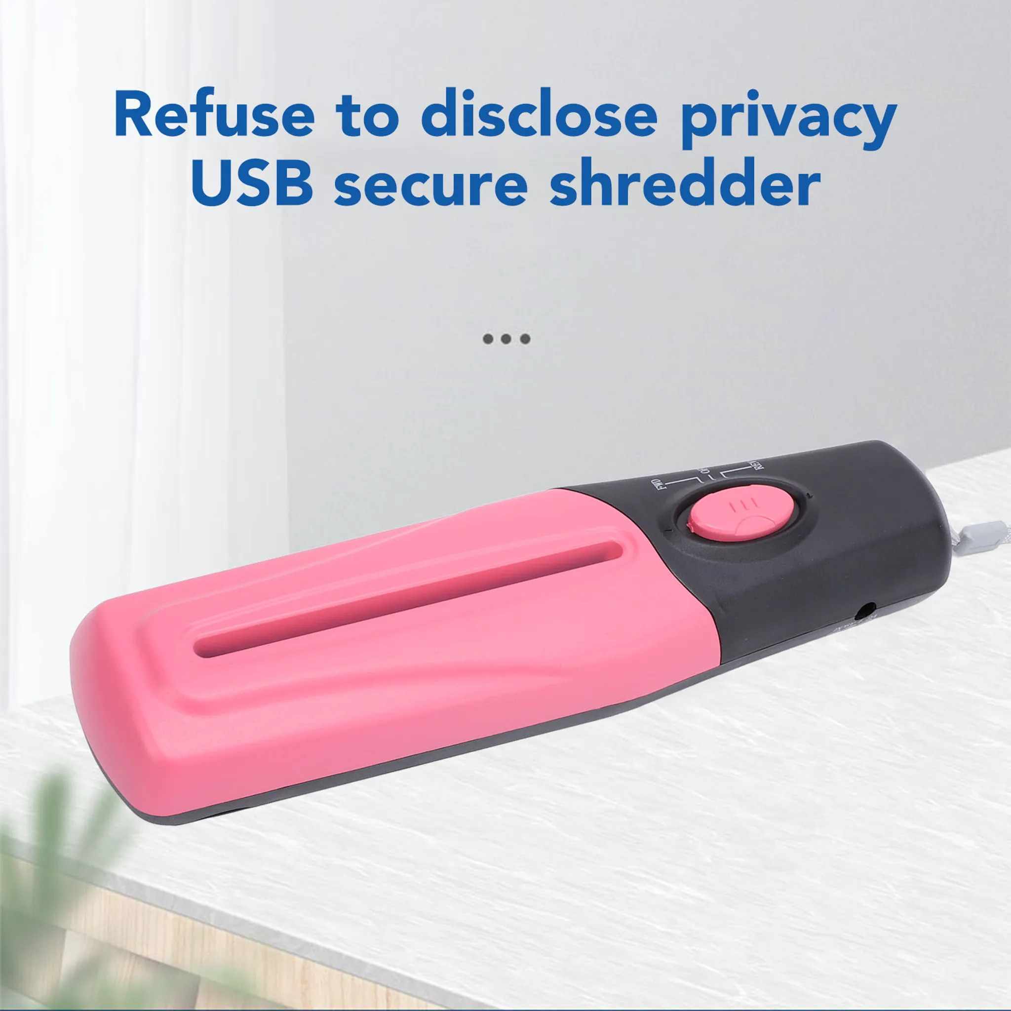 Pinker USB-Schredder mit schwarzem Griff und rotem Knopf.
