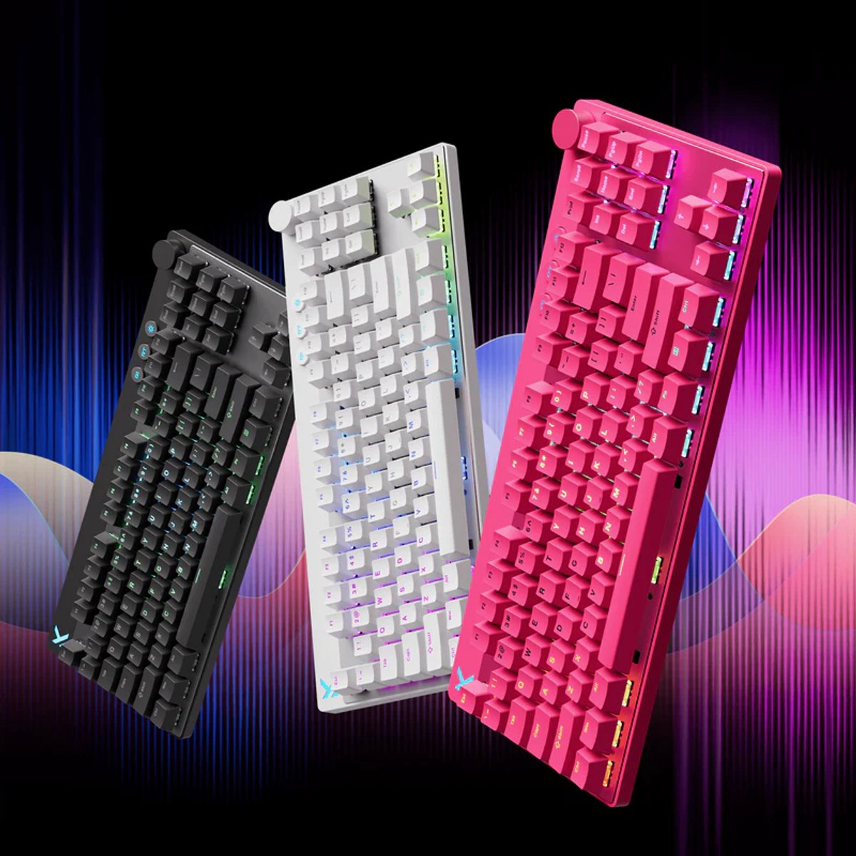 Three mechanical keyboards in black, white, and pink against a colorful background.