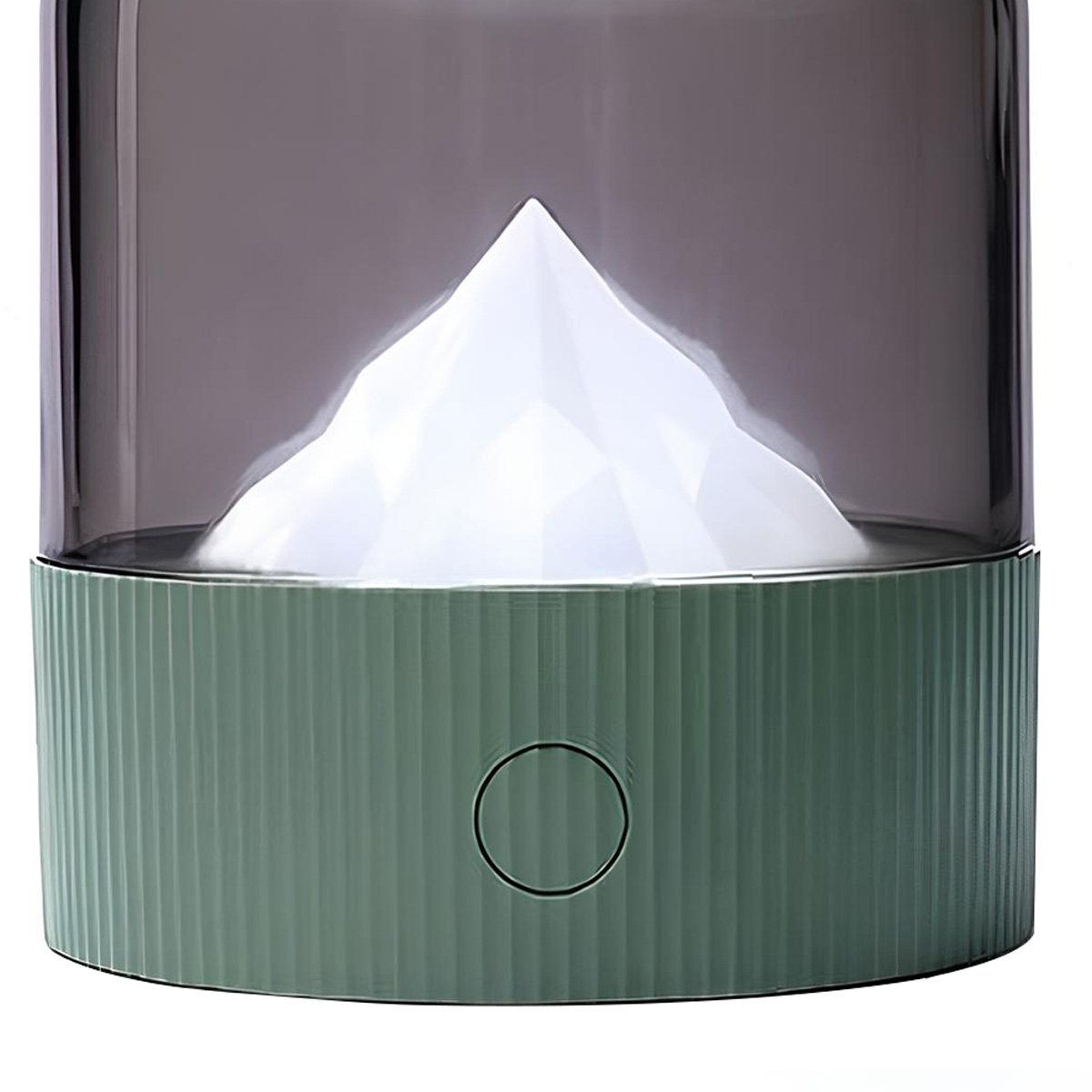 Eine grüne Lampe mit Bergmotiv und einem Rauchglas.