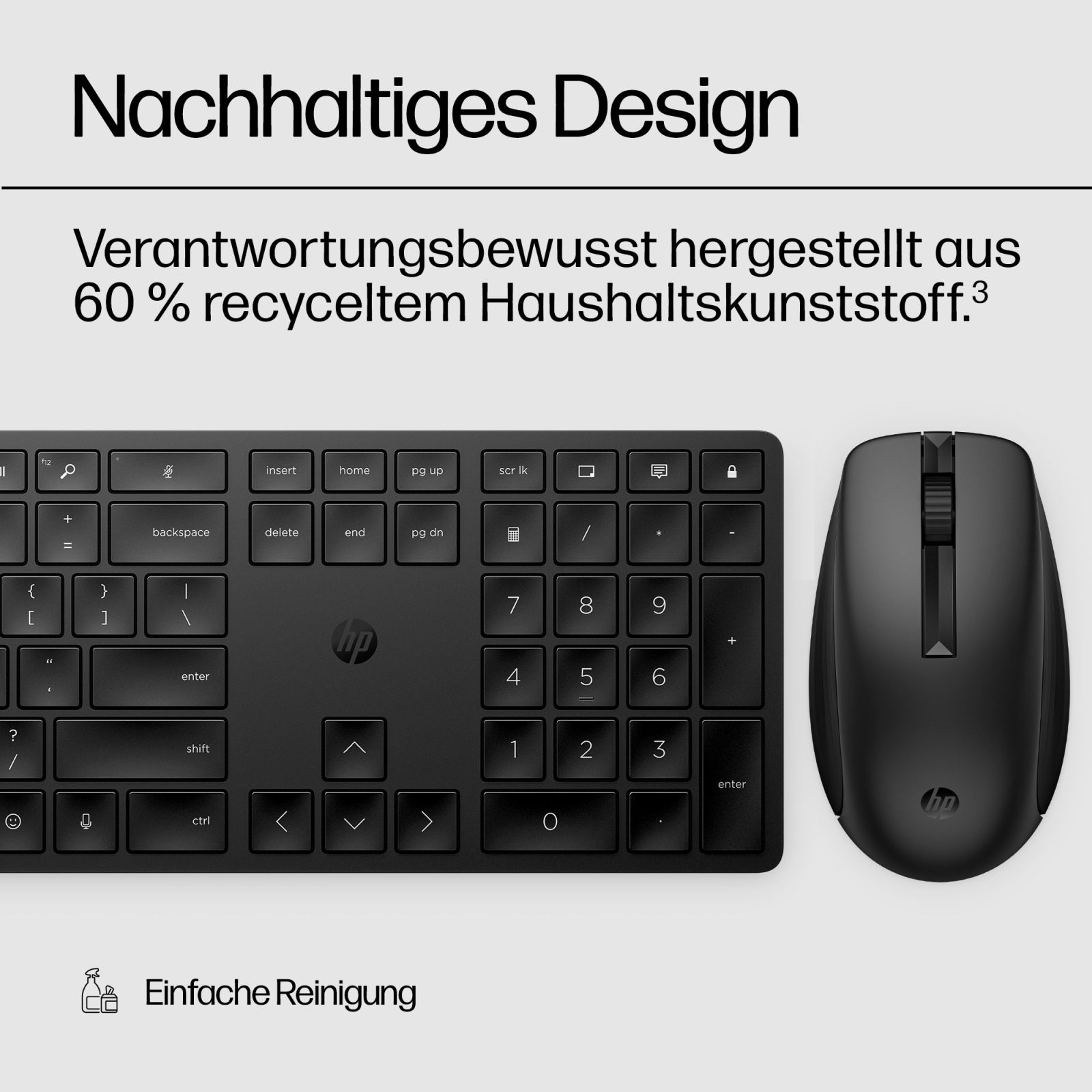 Schwarze HP Tastatur und Maus auf grauem Hintergrund mit Text.