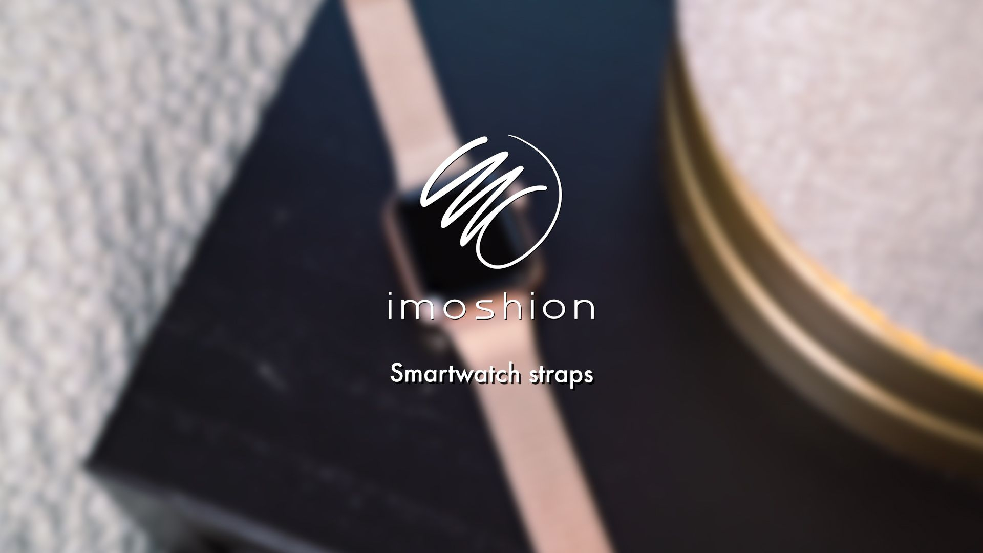 A rose gold smartwatch with a white logo and text 'imoshion'.