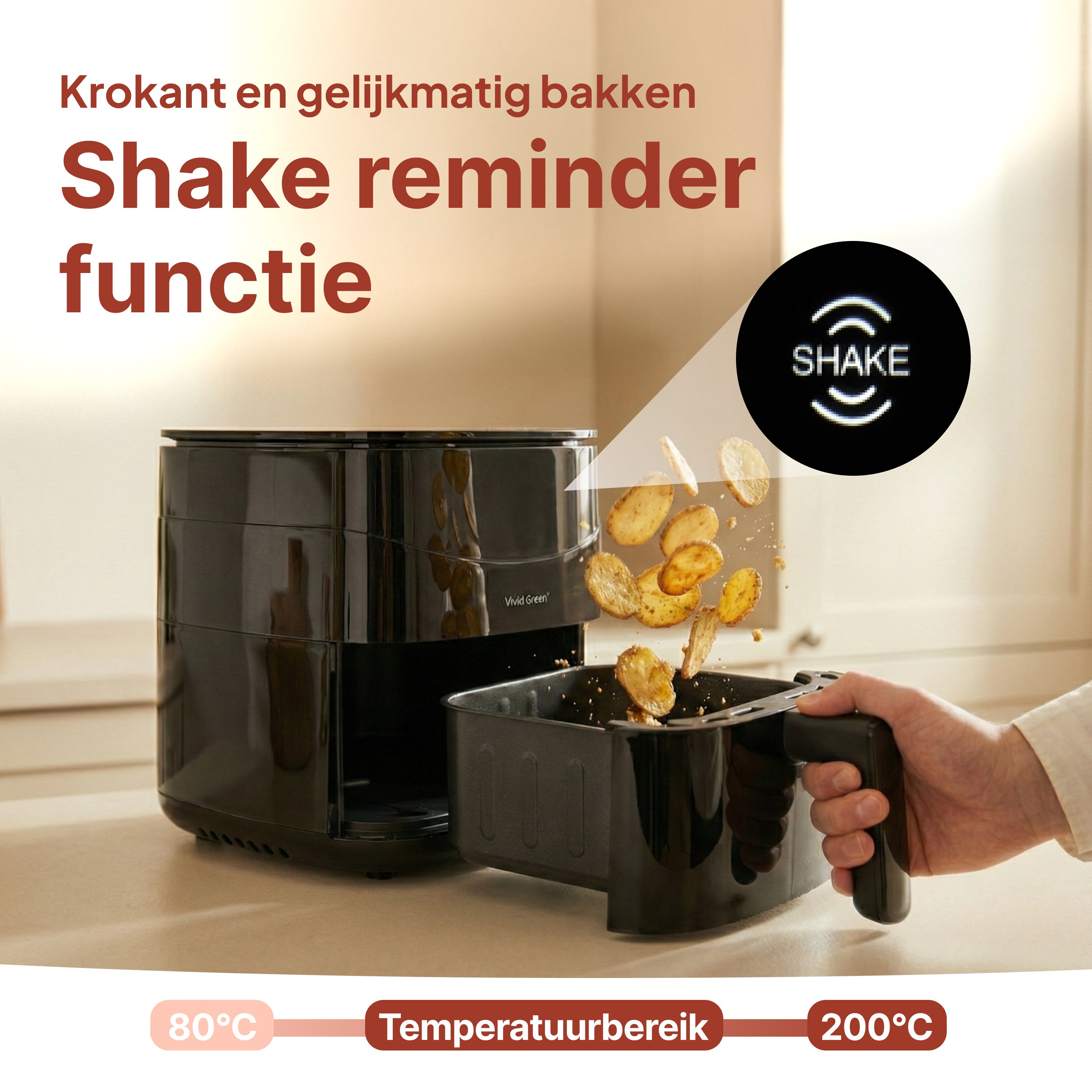 Black air fryer with pull-out basket, falling fries. SHAKE icon.