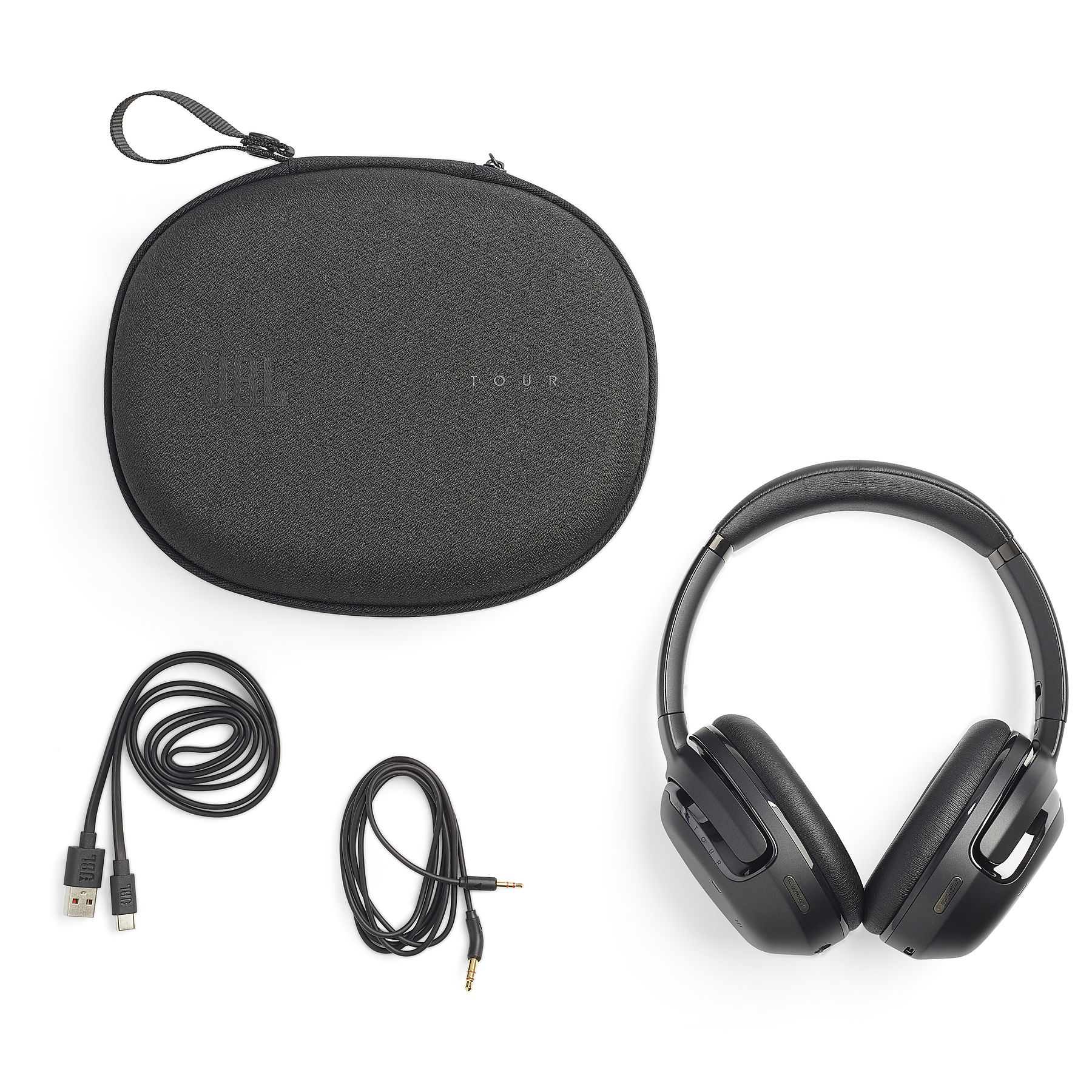Czarne słuchawki z akcesoriami: etui, kabel USB-C i kabel audio.