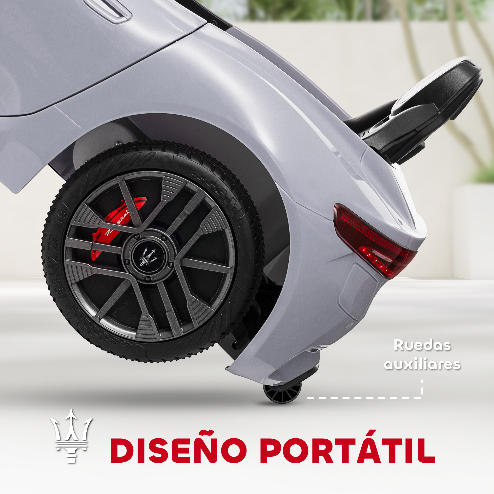 Coche eléctrico gris con pinzas de freno rojas y diseño de rueda.