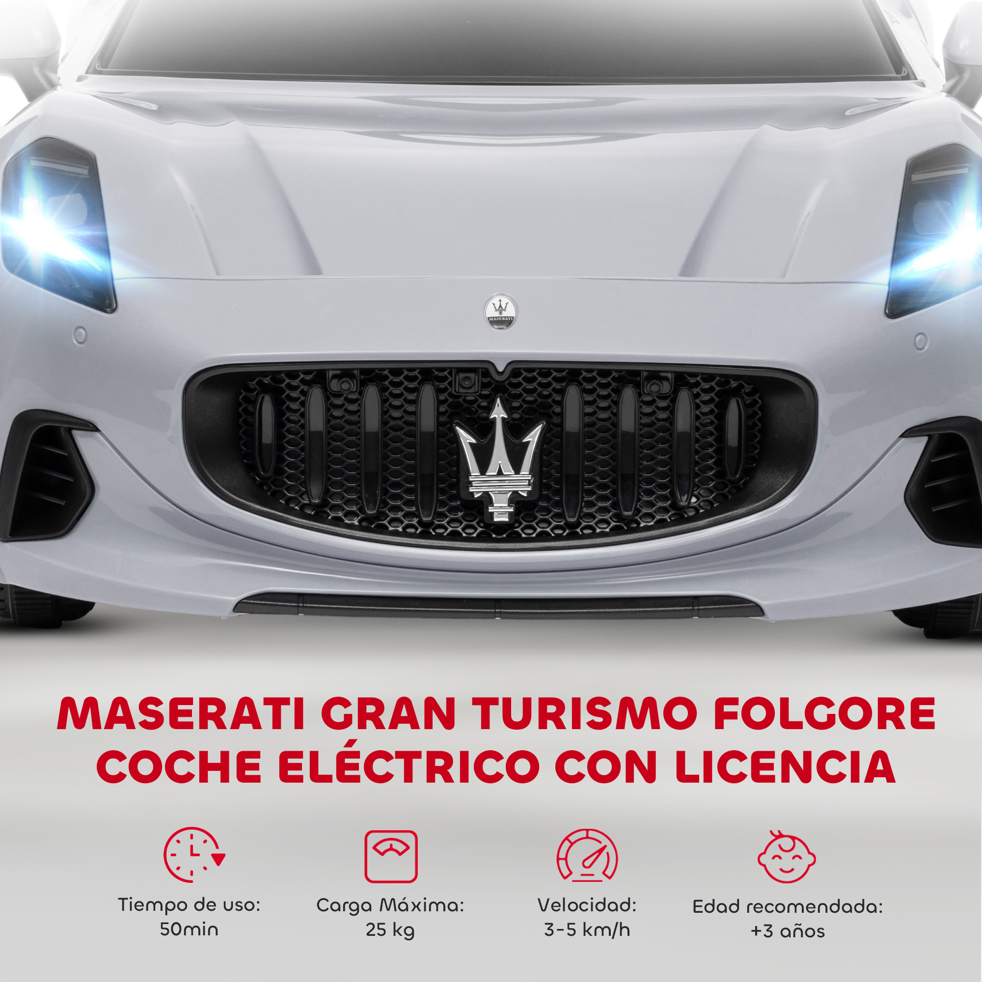 Maserati Gran Turismo gris con faros iluminados y emblema de marca.