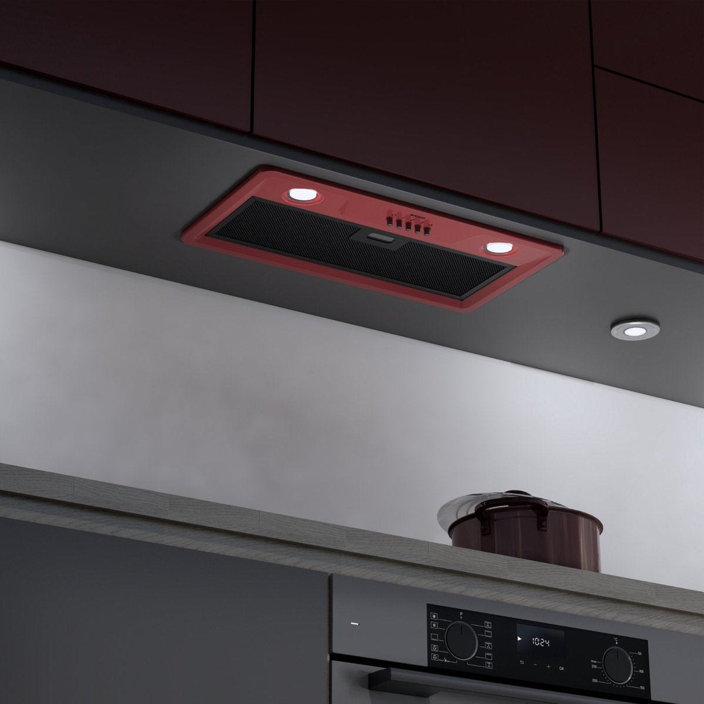Hotte rouge au-dessus d'une plaque de cuisson avec des casseroles.