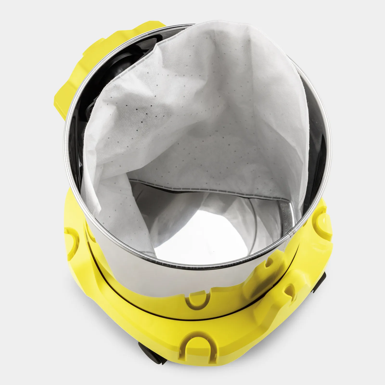 Żółty pojemnik odkurzacza z białym workiem na kurz, widok z góry.