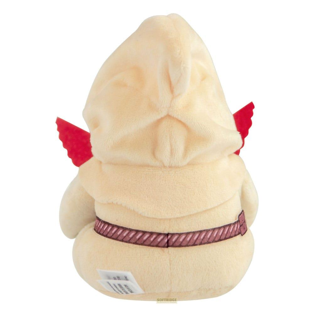 Un jouet en peluche beige avec une capuche, des ailes rouges et une ceinture.