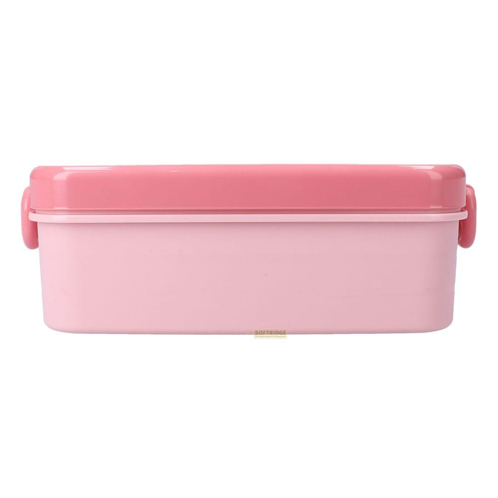 Eine rosafarbene Lunchbox mit zwei Verschlüssen an den Seiten.