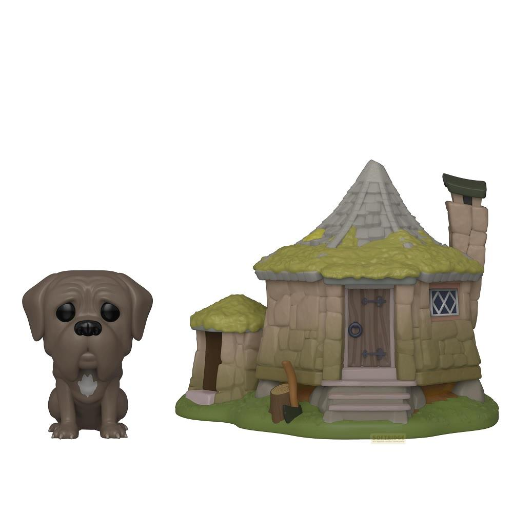 Ein brauner Hund und ein Steinhäuschen mit grünem Dach und Schornstein.