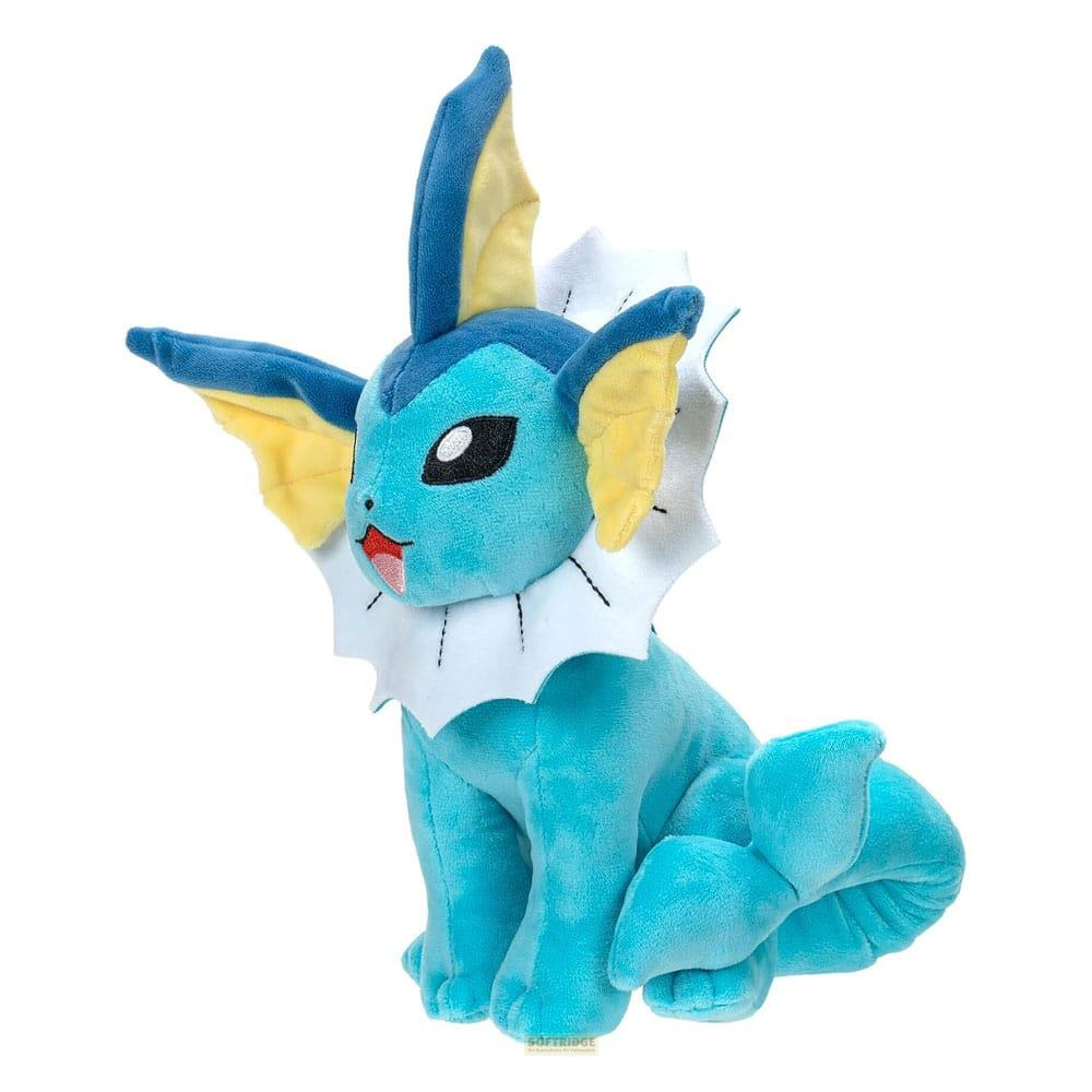 Ein blauer Vaporeon Plüsch mit gelben und weißen Akzenten sitzt.