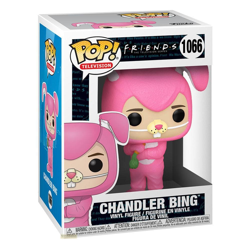 Action figure Funko Pop! di Chandler Bing in costume da coniglio rosa, tiene una carota.