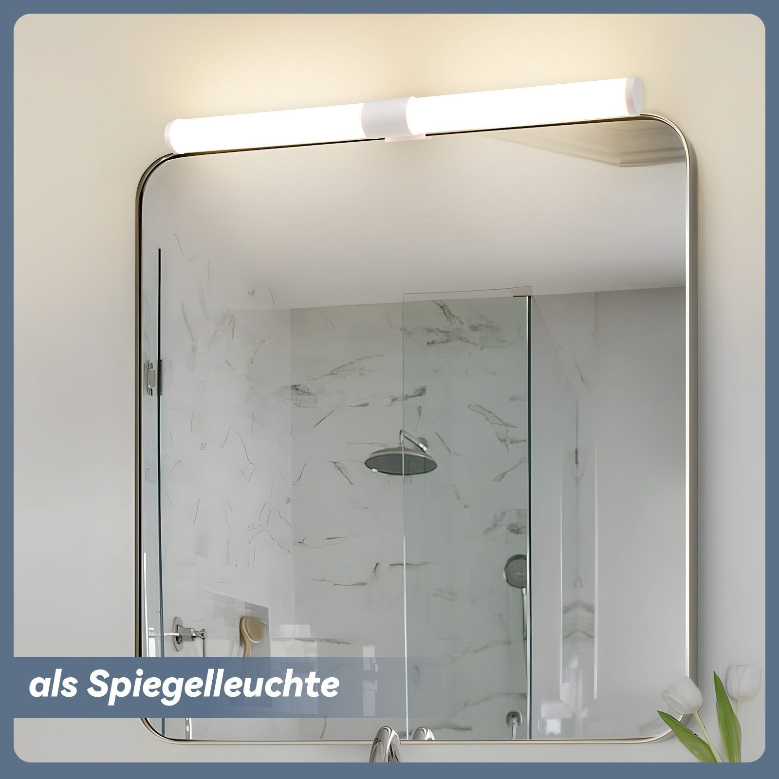 Uno specchio illuminato sopra un box doccia con piastrelle di marmo e soffione.