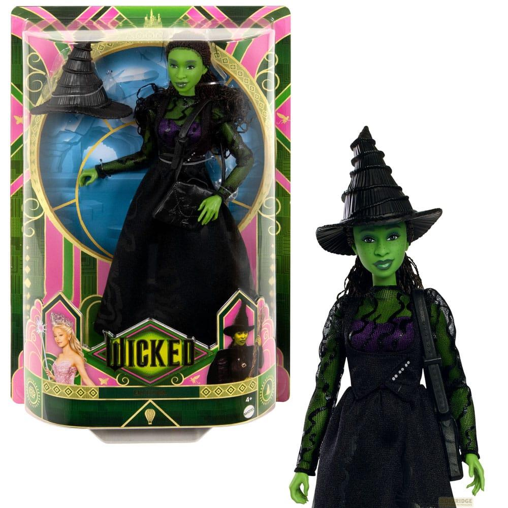 Bambola strega verde in abito e cappello neri, confezionata e sfusa.