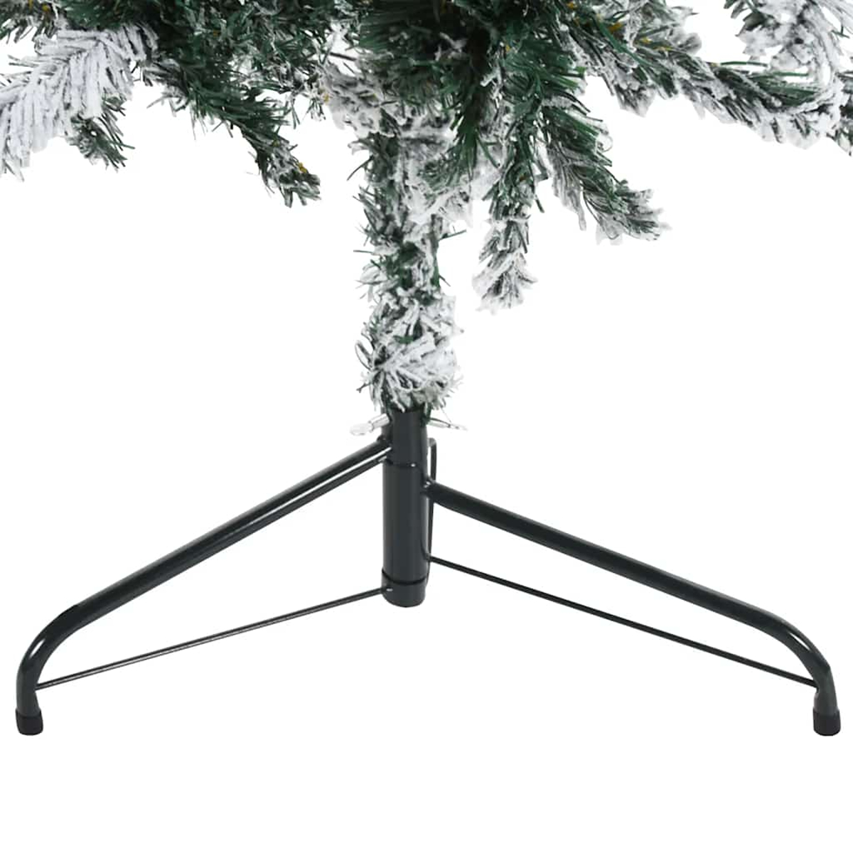 Ein Teil eines künstlichen Weihnachtsbaums mit grünem Laub und weißem Schnee