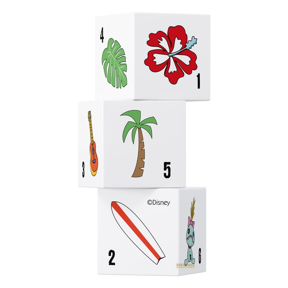 Trois cubes blancs empilés. Ils montrent une fleur, une feuille, une guitare, un palmier, une planche de surf, un personnage.